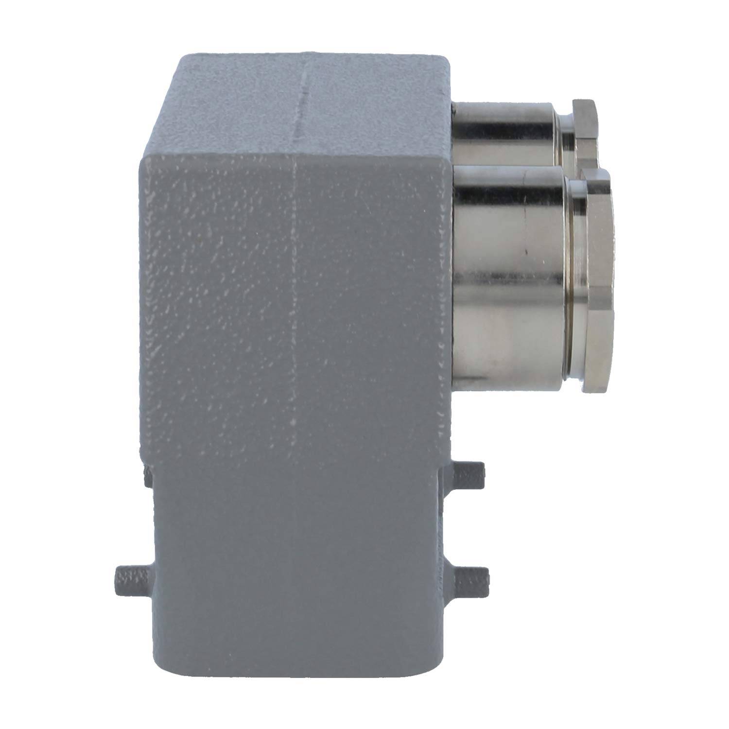 Das Bild zeigt eine graue, kastenförmige Industriekomponente mit zwei metallischen Anschlüssen an der Seite, die möglicherweise für elektrische Zwecke vorgesehen sind.