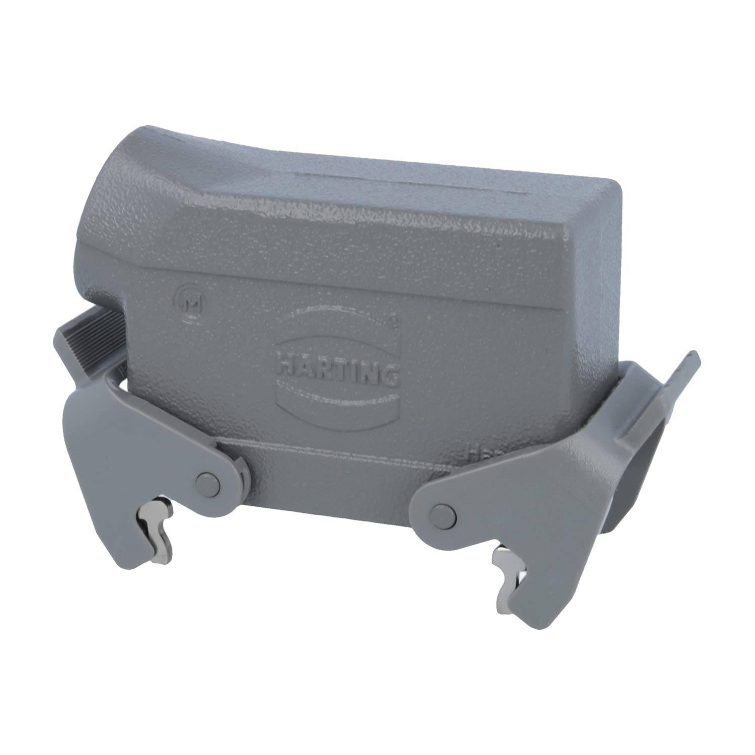 Ein metallisch grauer industrieller Steckverbindergehäuse mit seitlichen Verriegelungen, geprägt mit dem HARTING-Logo.