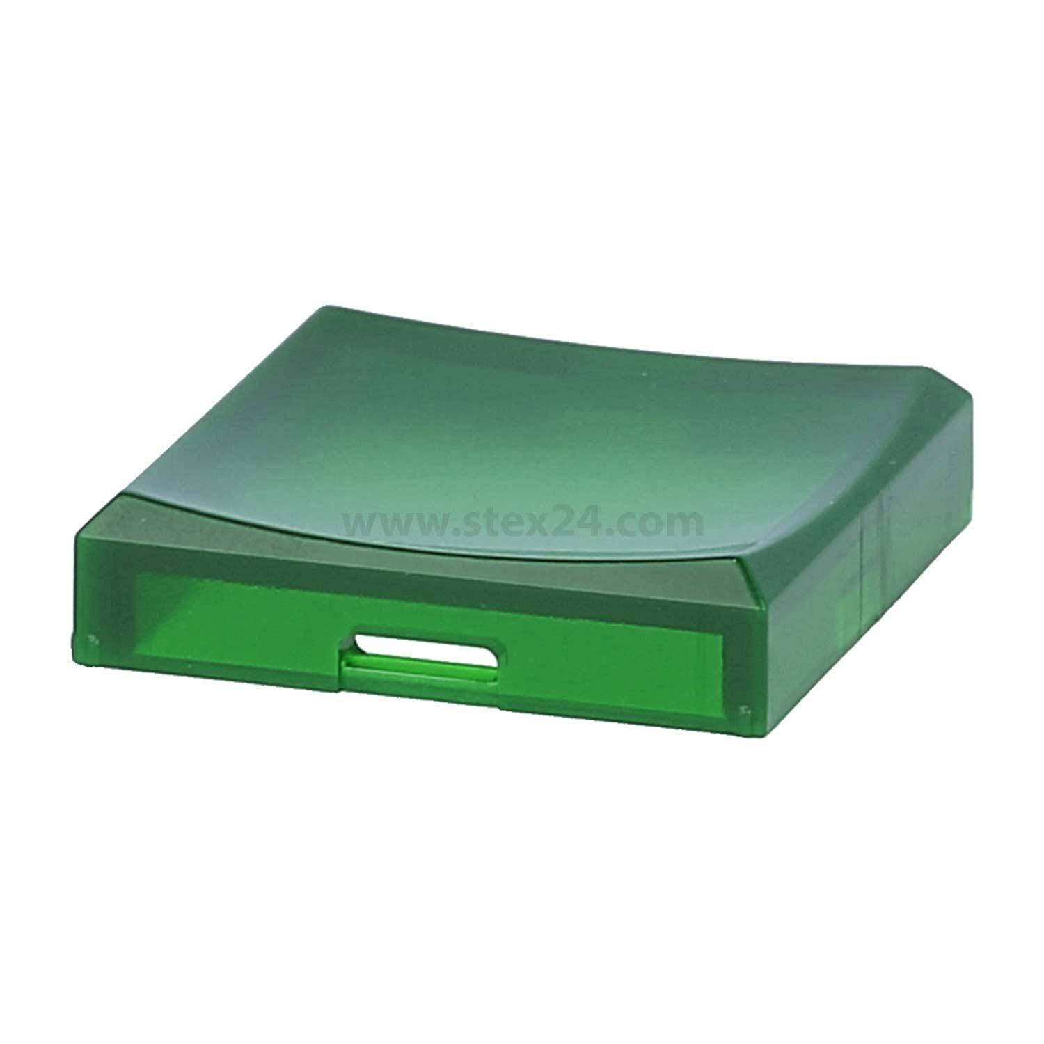 Ein kleiner, durchscheinender grüner Plastikgegenstand mit einer flachen Oberseite und einem Schlitz an einer Seite, möglicherweise eine kompakte Aufbewahrungsbox oder ein Halter.