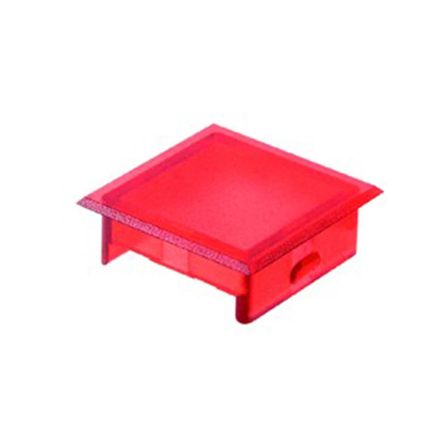 Eine kleine, rote, quadratische Plastikabdeckung mit einer flachen Oberseite und leicht erhöhten Kanten.