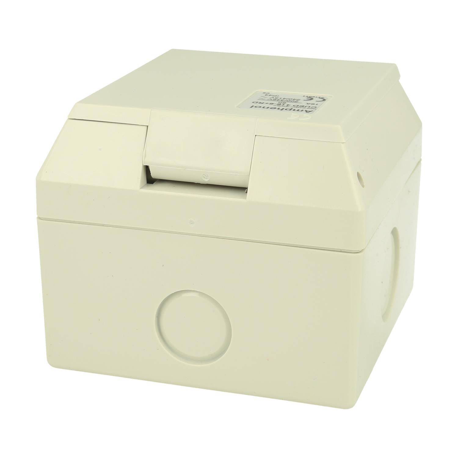 Ein beige-farbenes, rechteckiges Gehäuse zur Unterbringung elektronischer Komponenten, mit einem Deckel und einer kleinen kreisförmigen Vertiefung auf einer Seite.