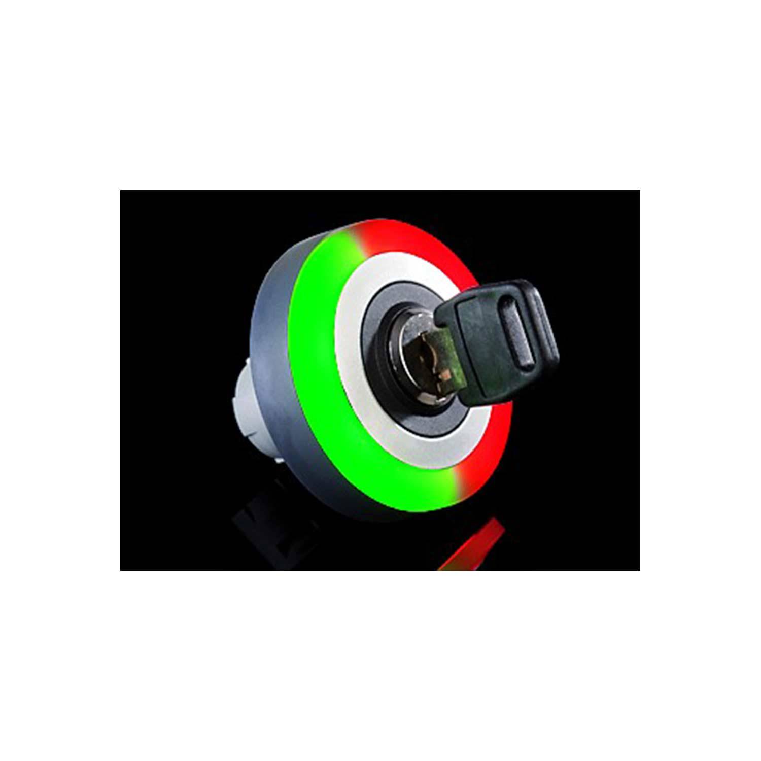 Ein kreisförmiger Indikator mit roten und grünen LED-Leuchten umgibt einen Schlüsselschlitz, der vor einem schwarzen Hintergrund beleuchtet ist.