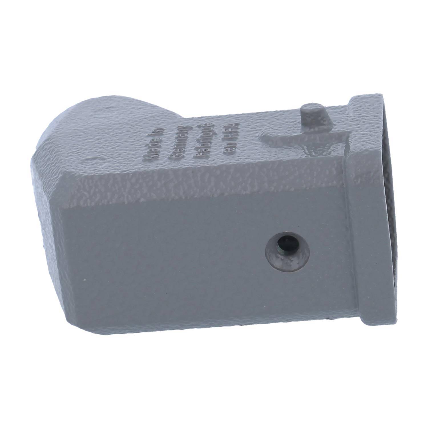 Ein grauer Metallgegenstand mit strukturierter Oberfläche, der eine rechteckige Form mit abgerundeter Kante und einem Loch an einer Seite aufweist.