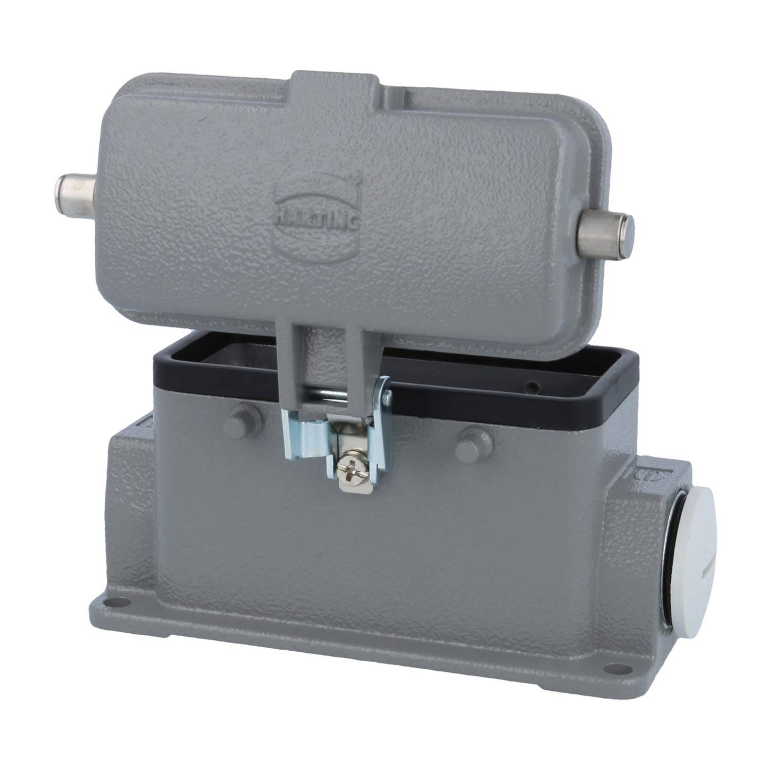 Industrielles graues Gehäuse für Schwerlast-Verbindungsstecker mit Klappdeckel, das einen Verschlussmechanismus und Befestigungslöcher zeigt.