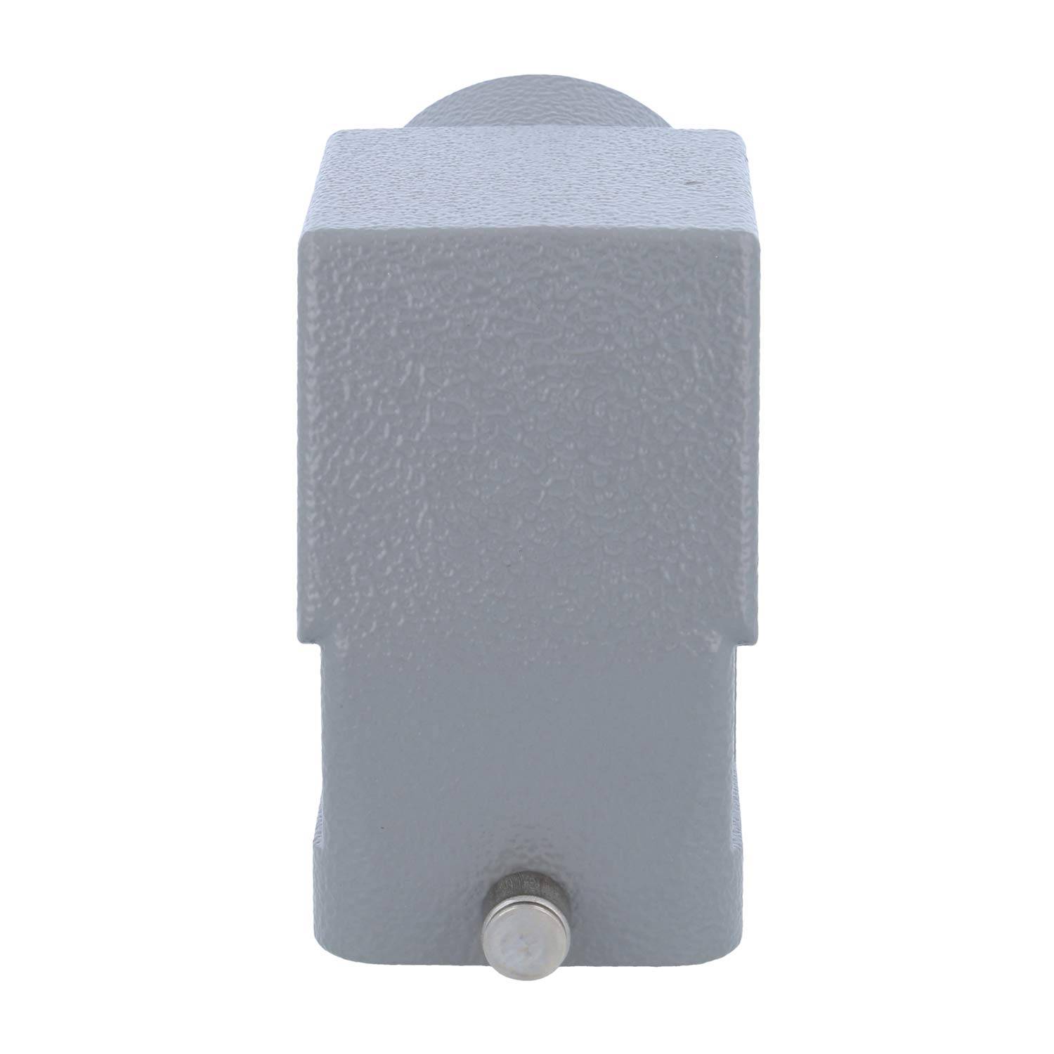 Ein grauer Metallblock mit einem kleinen, runden, metallischen Knopf auf seiner Oberfläche. Es scheint Teil einer mechanischen oder industriellen Vorrichtung zu sein.