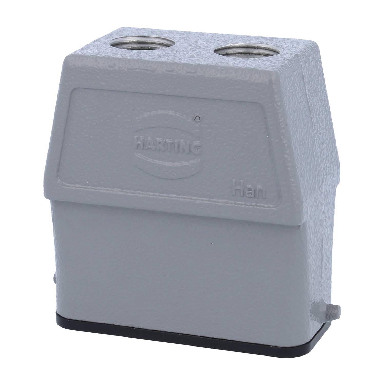 Ein grauer HARTING Han industrieller Steckverbinder mit zwei kreisförmigen Öffnungen oben, verwendet zur Verbindung elektrischer Komponenten.