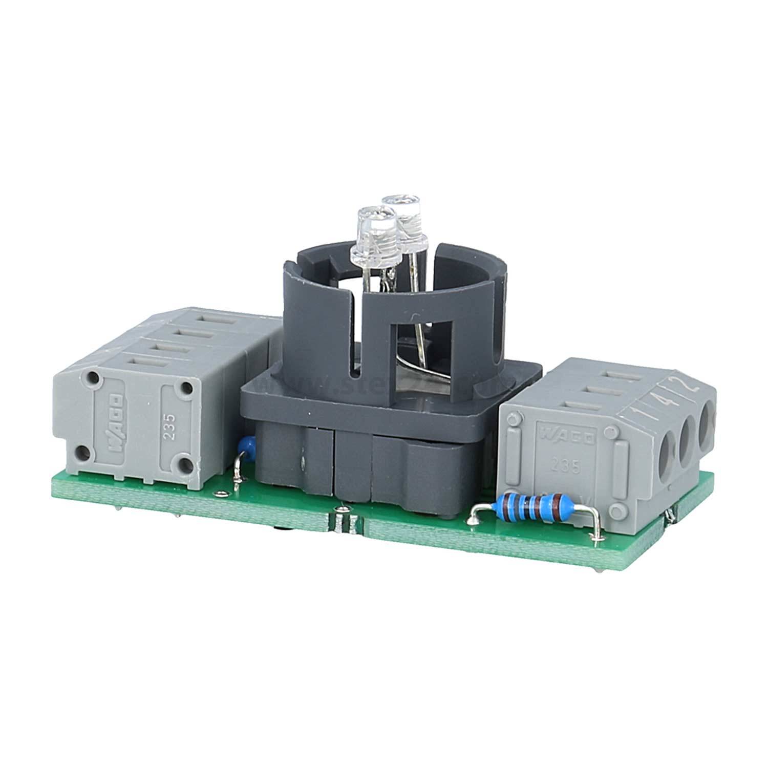 Eine kleine, grüne Leiterplatte mit grauen und schwarzen Komponenten, mit einem zentralen Lichtsensor und mehreren verbundenen Widerständen.