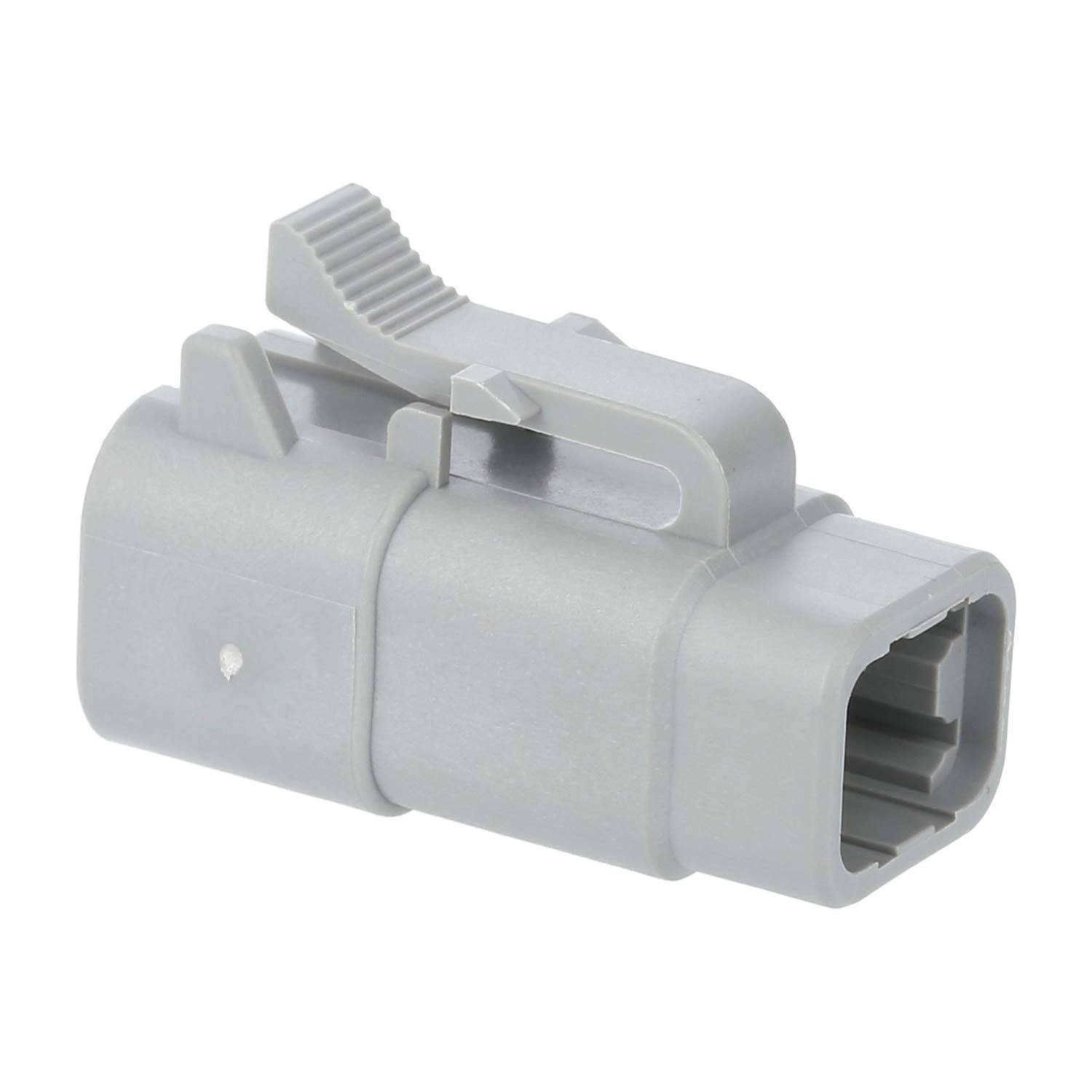 Ein grauer Kunststoff-Elektroverbinder mit einer Verriegelungslasche und einer rechteckigen Öffnung für Kabel.