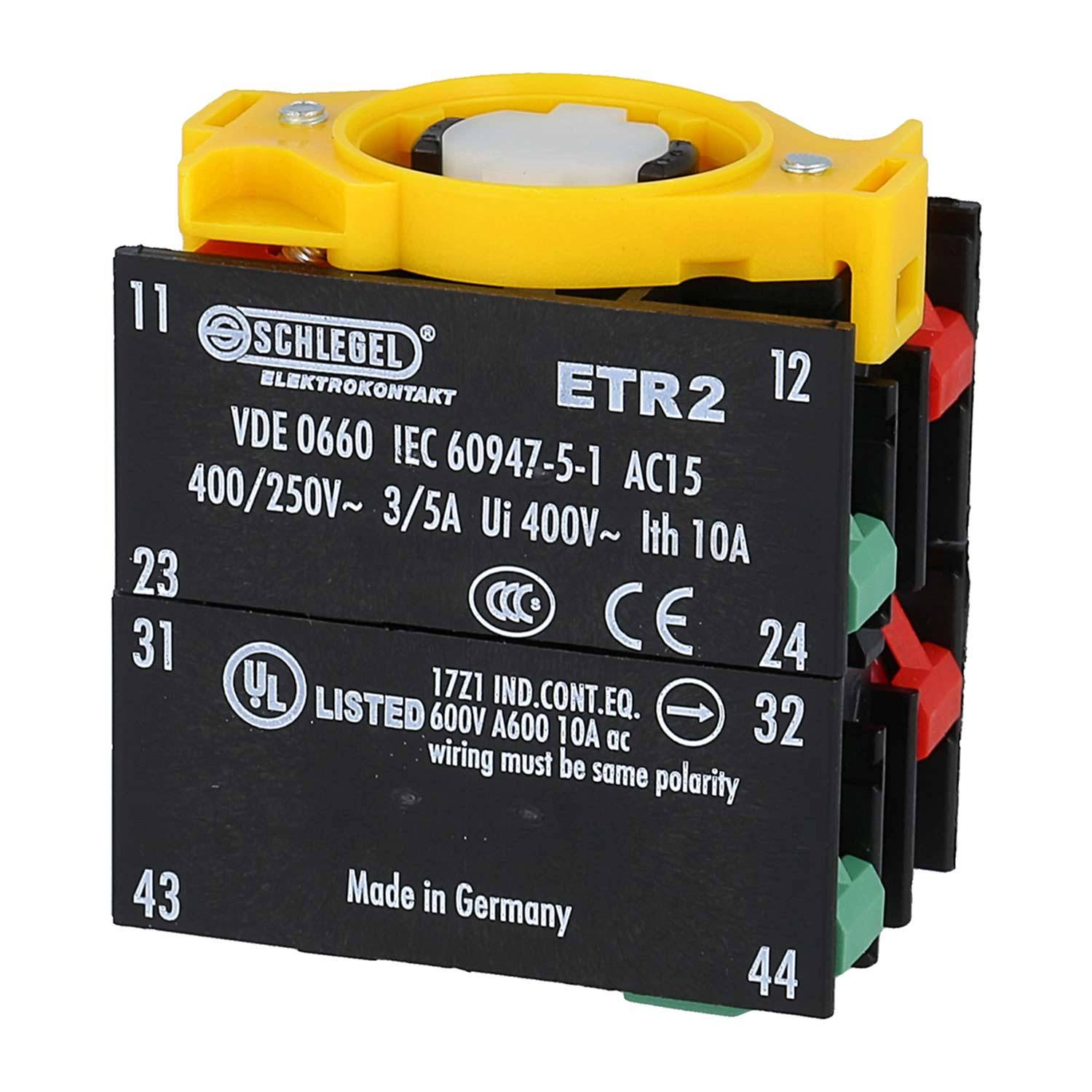 Schwarzes elektronisches Steuergerät mit technischen Spezifikationen, einschließlich Bewertungen für Spannung und Stromstärke. Gelbe Komponente oben drauf.