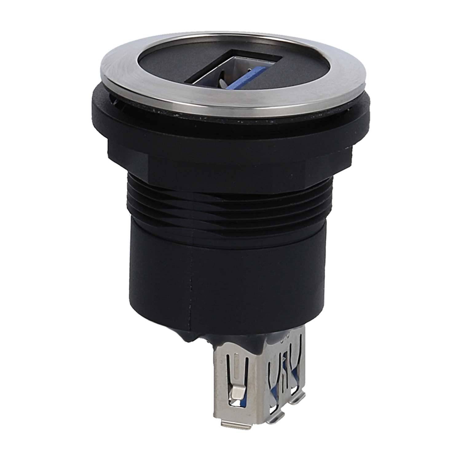 Ein schwarzer und silberner USB-Anschluss mit einer kreisförmigen Gestaltung. Die USB-Öffnung befindet sich an der Oberseite.