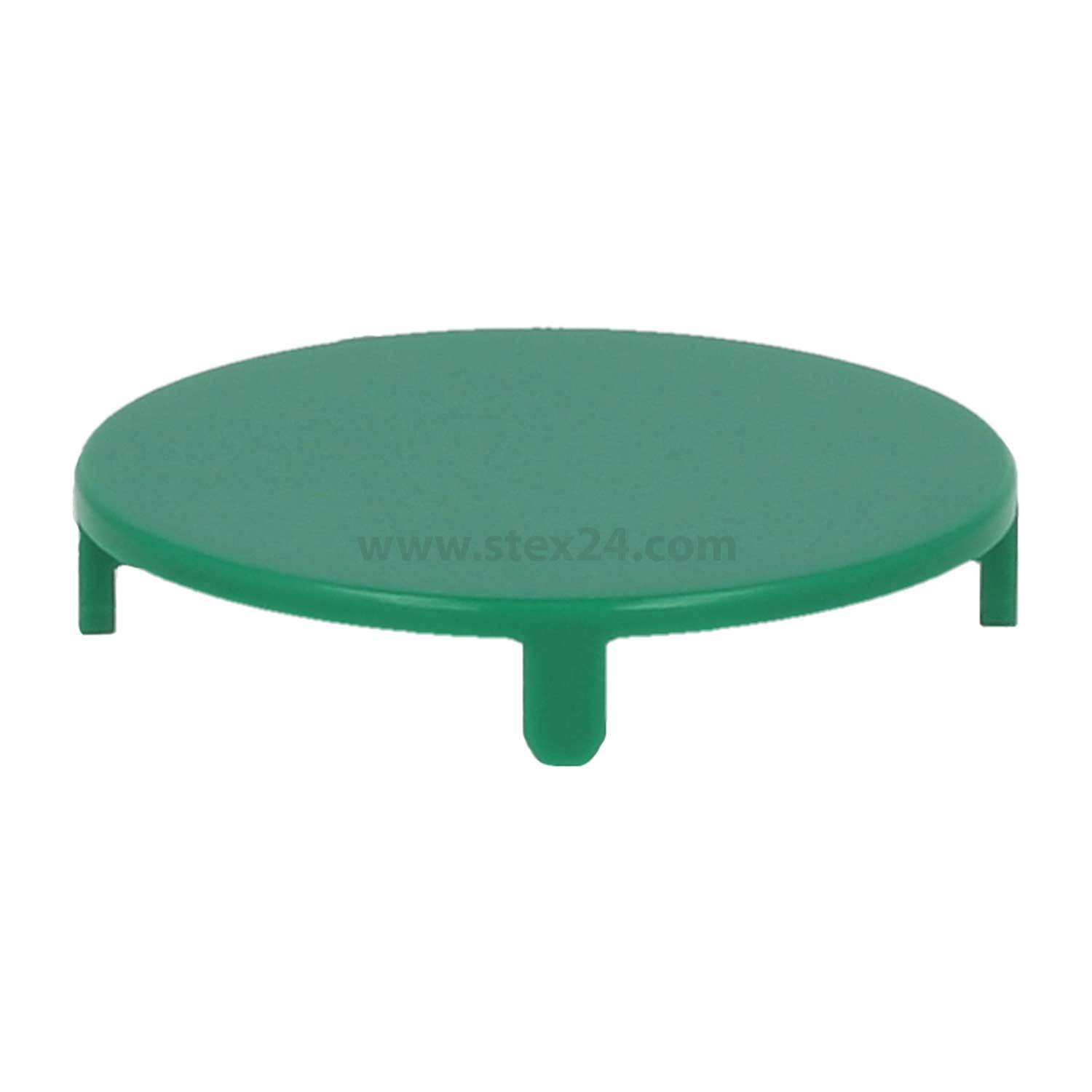 Ein rundes, grünes, flaches Plastikbauteil mit drei kleinen Beinen zur Abstützung, das wie eine Plattform oder Abdeckung aussieht.