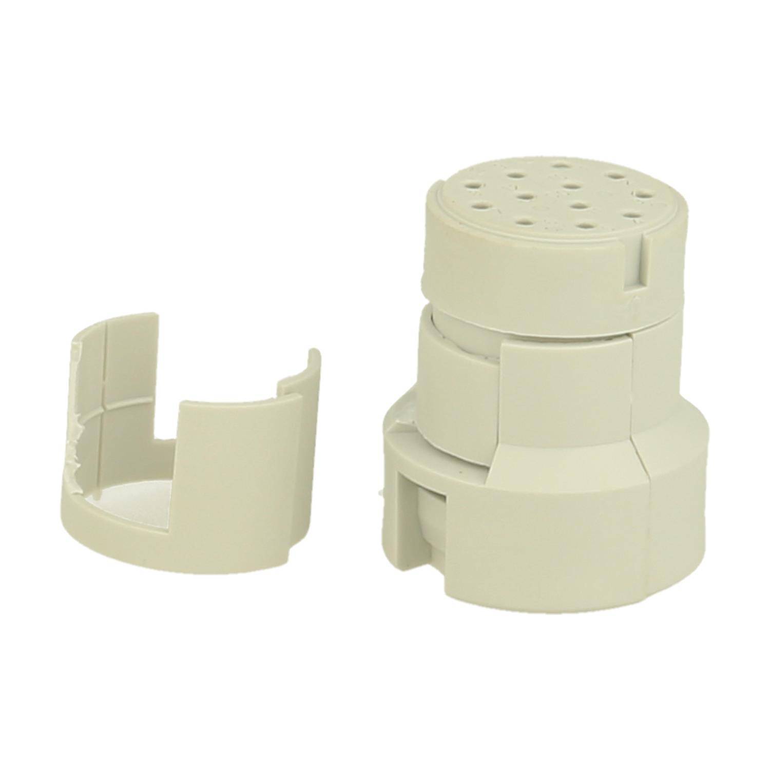 Eine beige Kunststoffhalterungskomponente, die in mehrere ineinandergreifende Teile zerlegt ist und zum Organisieren oder Befestigen von Kabeln oder Ausrüstung verwendet wird.