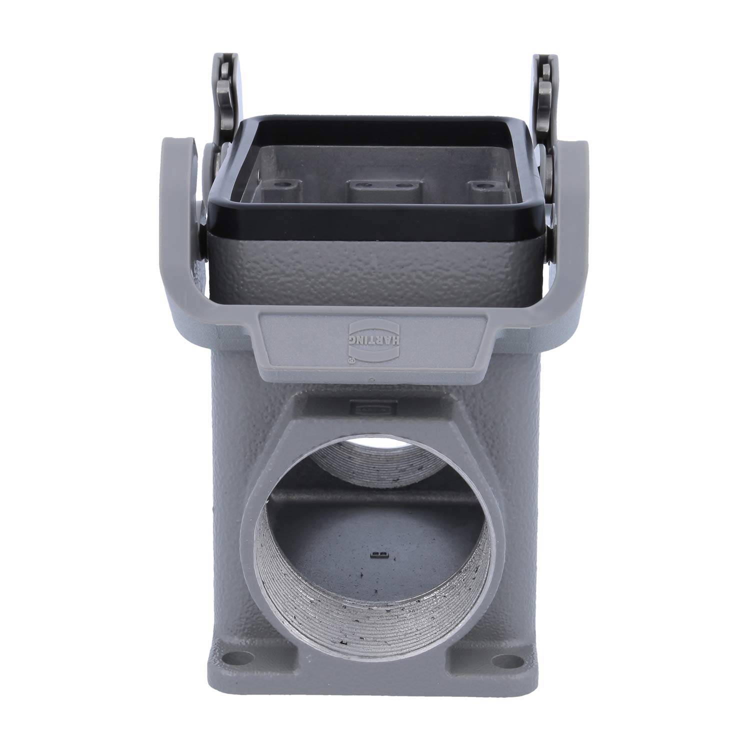 Ein grauer industrieller Anschlussblock mit quadratischer Oberseite und kreisförmiger Öffnung an der Vorderseite, geeignet für elektrische und mechanische Verbindungen.