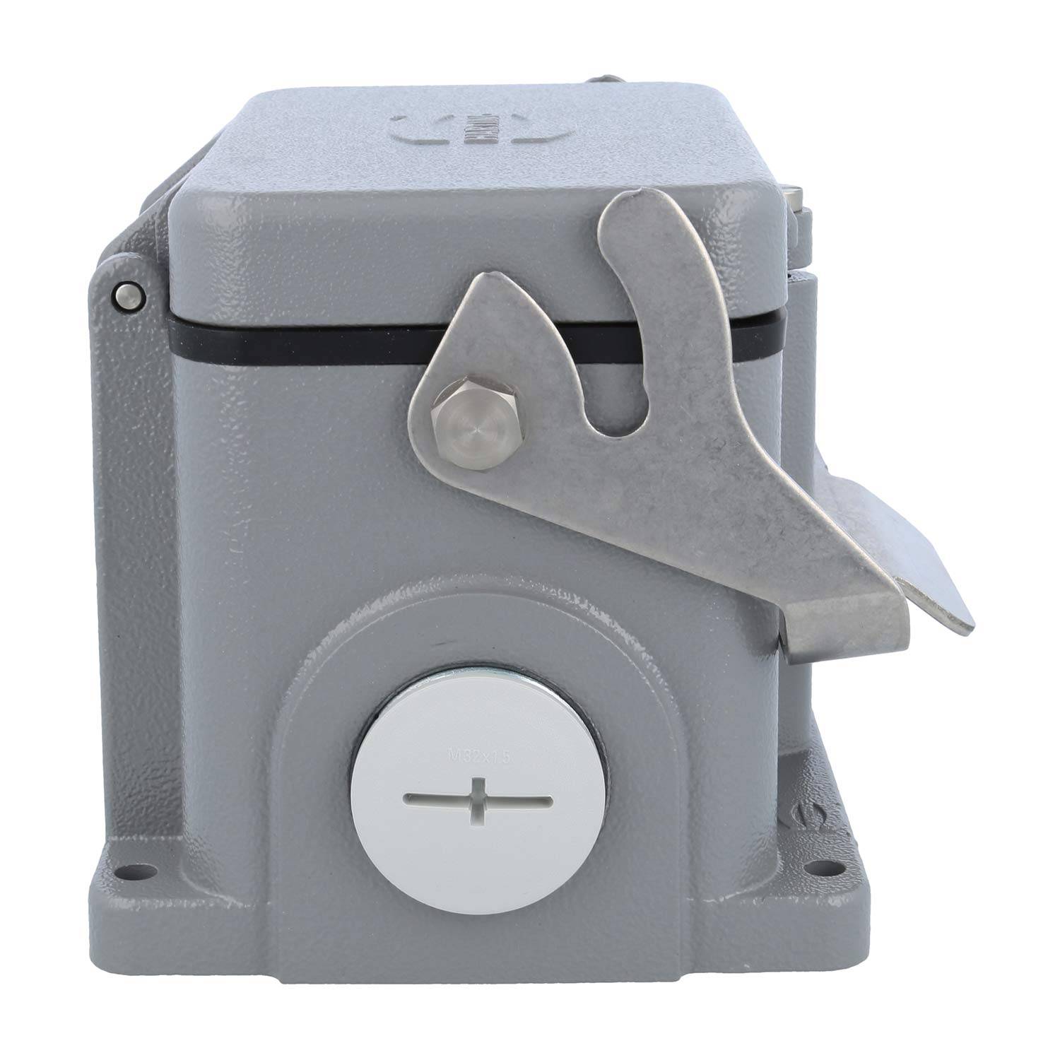 Ein grauer industrieller Fußschalter mit einer Schutzabdeckung und einem '+' Symbol auf der Taste, konzipiert für eine bedienungsfreie Nutzung an Maschinen.