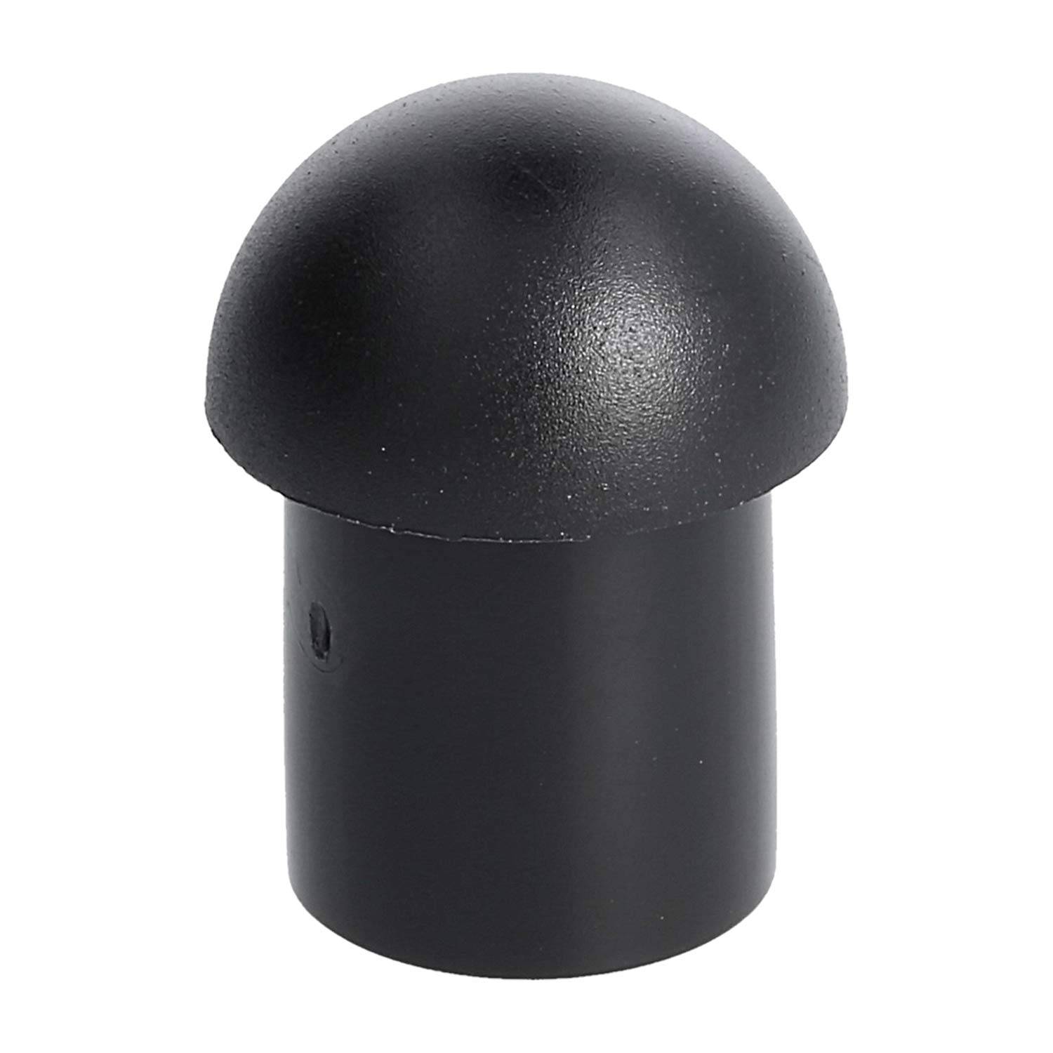 Eine schwarze, abgerundete Plastikkappe mit glatter Oberfläche und einem kleinen seitlichen Loch.