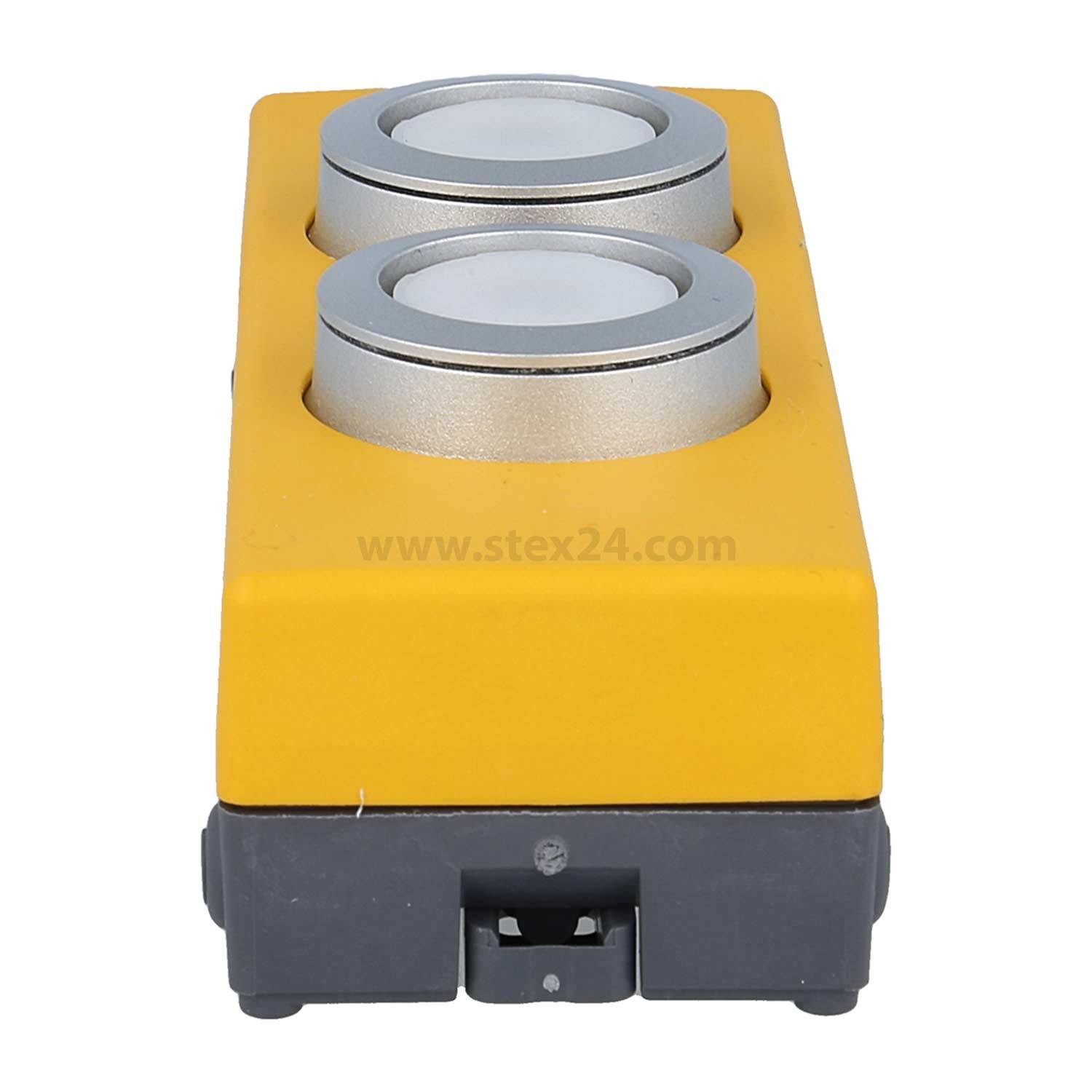 Eine gelbe und graue industrielle Steuerungsschaltbox mit zwei runden Tastern auf der Oberseite.