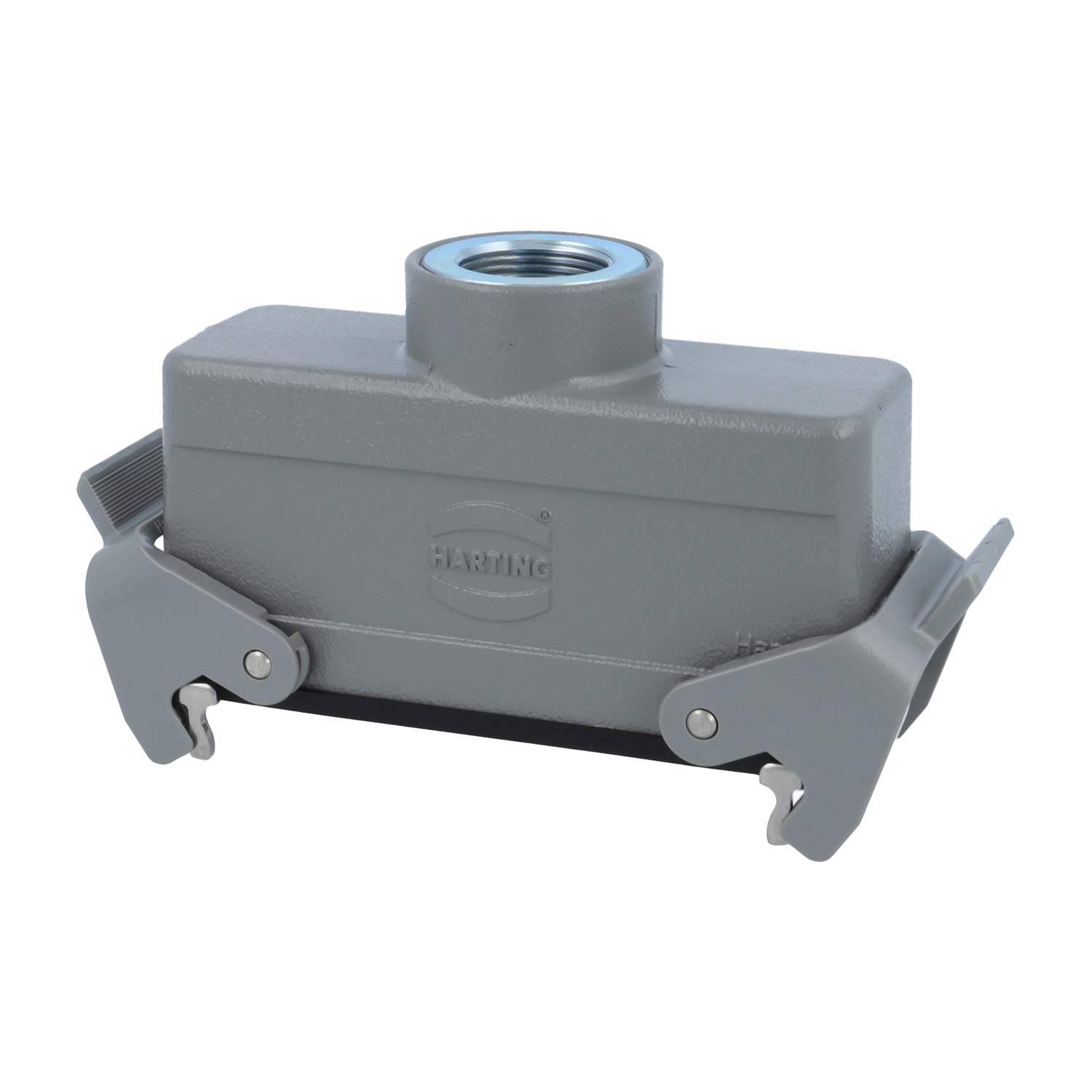 Ein grau-industrielles Steckergehäuse mit seitlichen Verriegelungen und einem Gewindebohrung an der Oberseite, verwendet zum Sichern elektrischer Verbindungen.