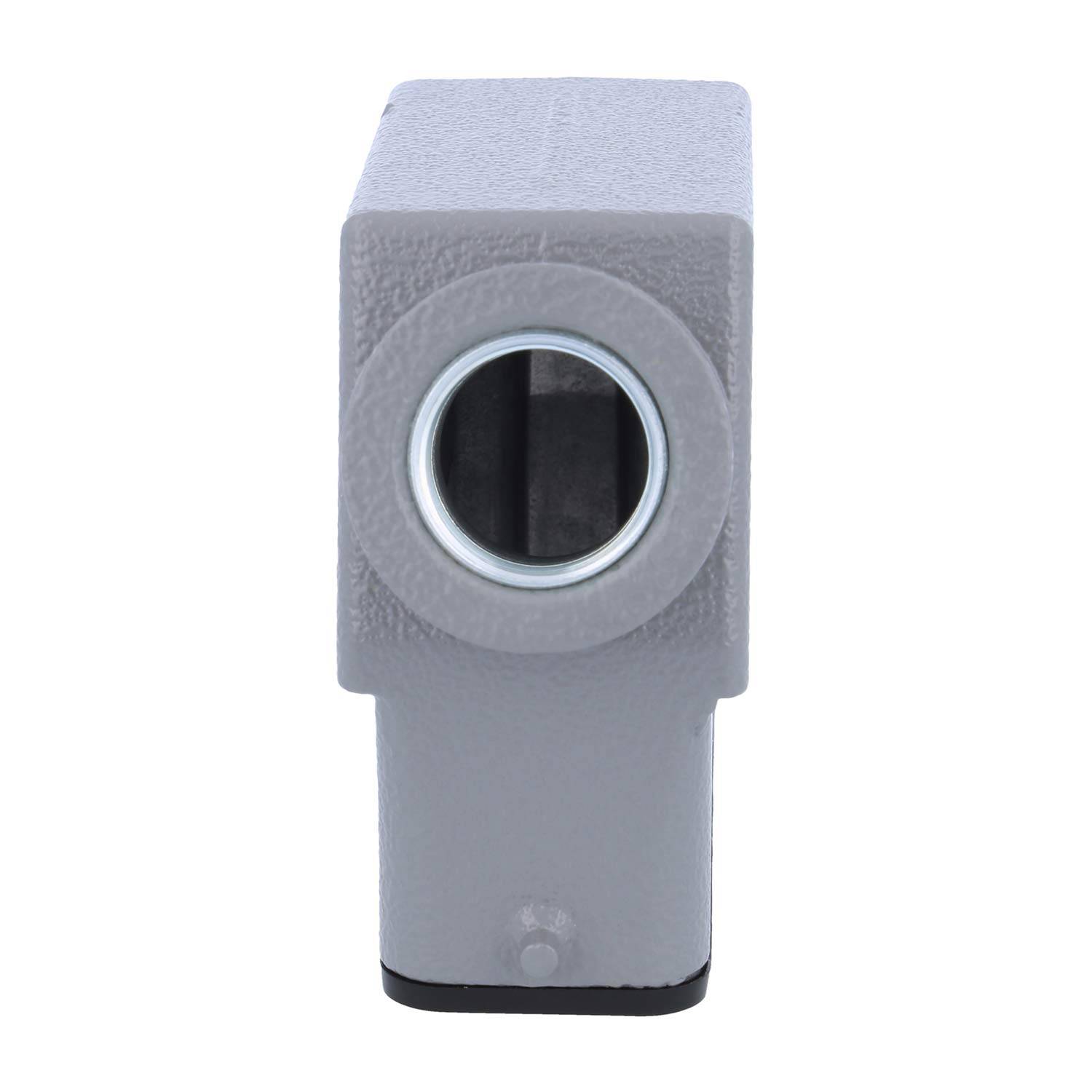 Ein grauer Metallblock mit einer kreisförmigen Öffnung in der Mitte, möglicherweise eine Komponente oder ein Teil einer mechanischen Vorrichtung.