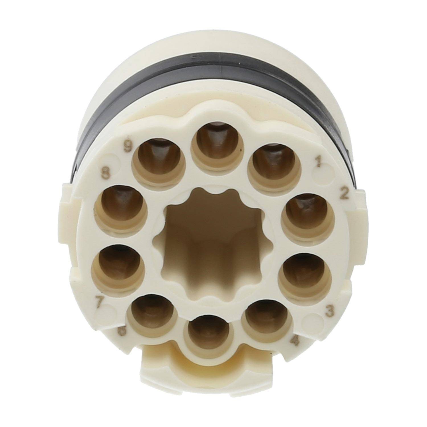 Ein cremefarbenes Plastikteil mit zylindrischen Öffnungen, die in einem Kreis angeordnet sind und an der oberen Kante mit einem schwarzen Rand verbunden sind.