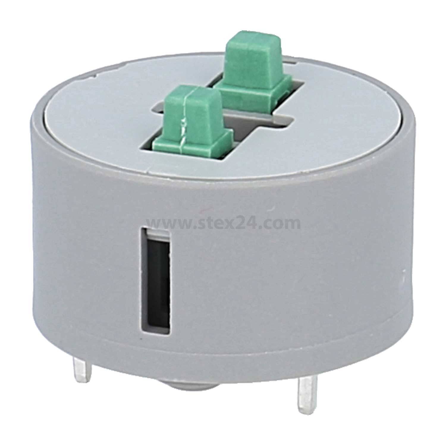 Ein grauer zylindrischer Adapter mit zwei grünen Laschen und drei Stiften, konzipiert für elektronische Verbindungen.