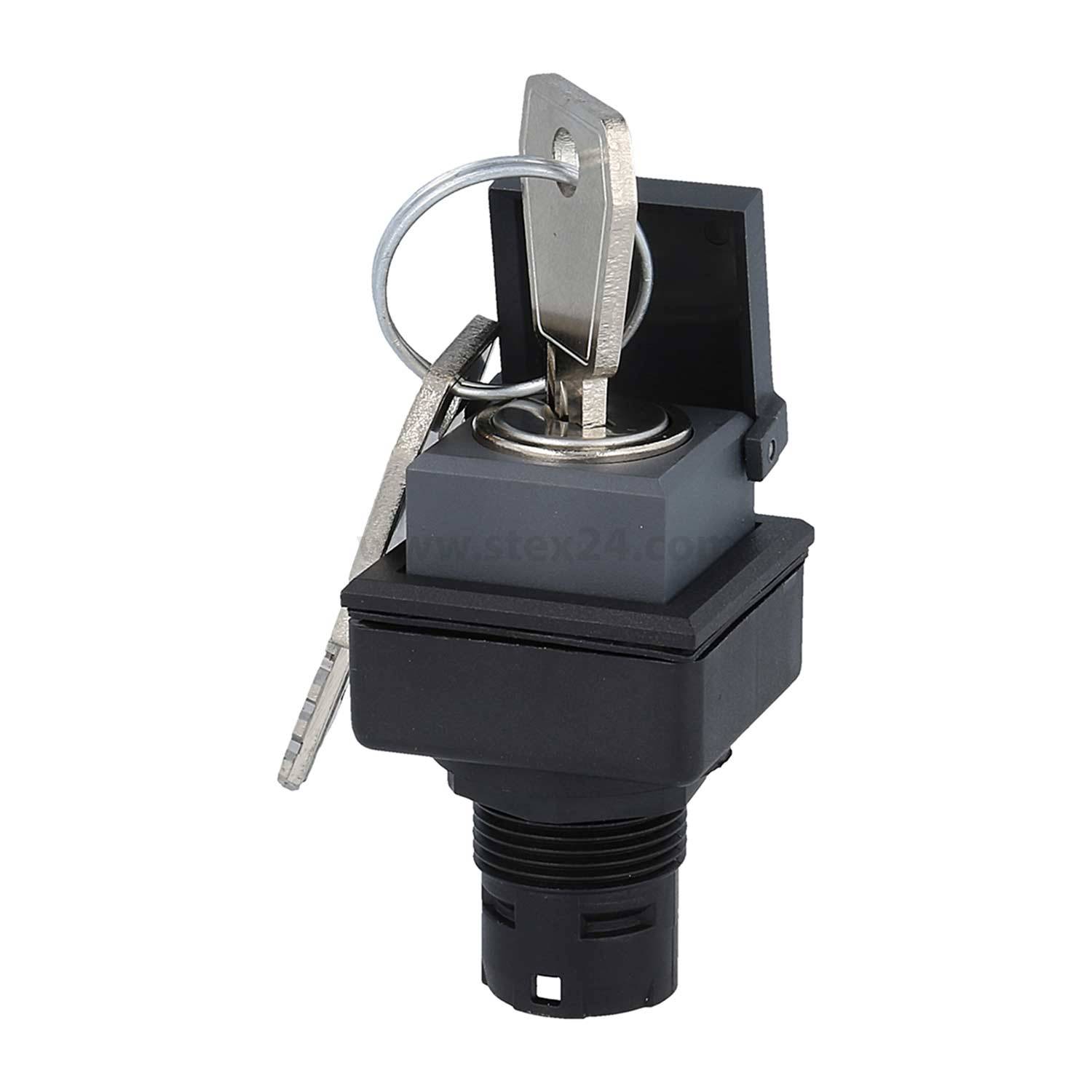 Ein Schlüssel, der in einen schwarzen und grauen industriellen Schlüsselschalter mit offener Schutzabdeckung eingesteckt ist. Der Schlüssel ist an einem silbernen Schlüsselanhänger befestigt.