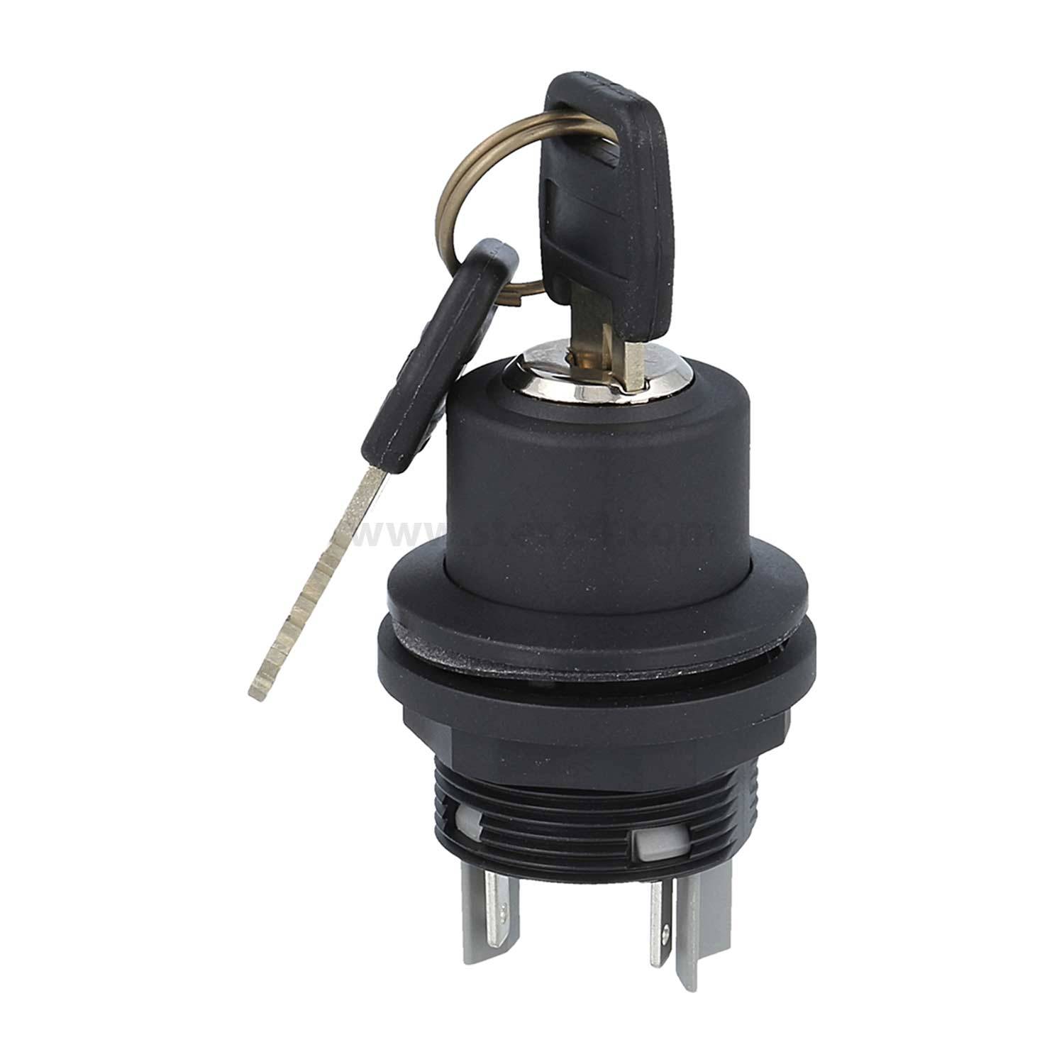 Ein schwarzer Zündungsschlüsselschalter mit zwei eingesteckten Schlüsseln, versehen mit drei Metallvorsprüngen an der Unterseite für die elektrische Verbindung.