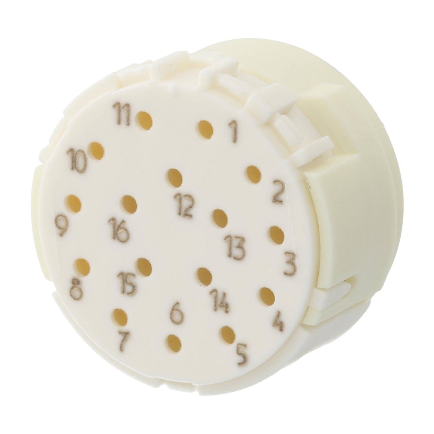 Kreisförmiger beige-farbener Gegenstand mit kleinen nummerierten Löchern, möglicherweise Teil einer mechanischen oder elektronischen Vorrichtung, mit Zahlen von 1 bis 16, die um die Oberfläche verteilt sind.