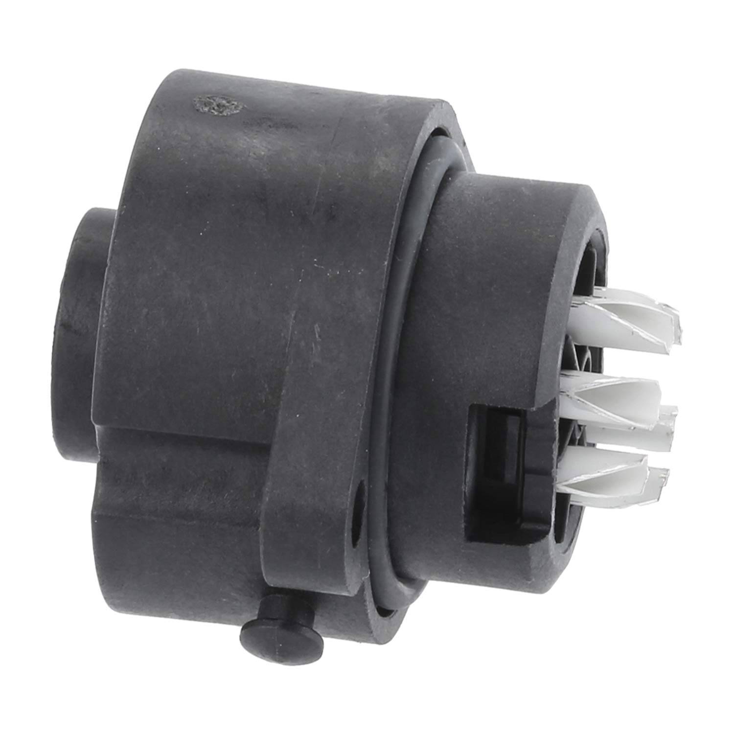 Eine schwarze zylindrische elektrische Komponente mit weißen, klauenartige Stiften, die in Zündungssystemen von Kraftfahrzeugen zur Schaltungsverbindung verwendet wird.