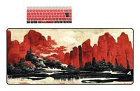 Eine Schreibtischunterlage mit einer Szenerie aus roten Bergen und Bäumen, kombiniert mit einer passenden Tastatur mit roten und schwarzen Tastenkappen.