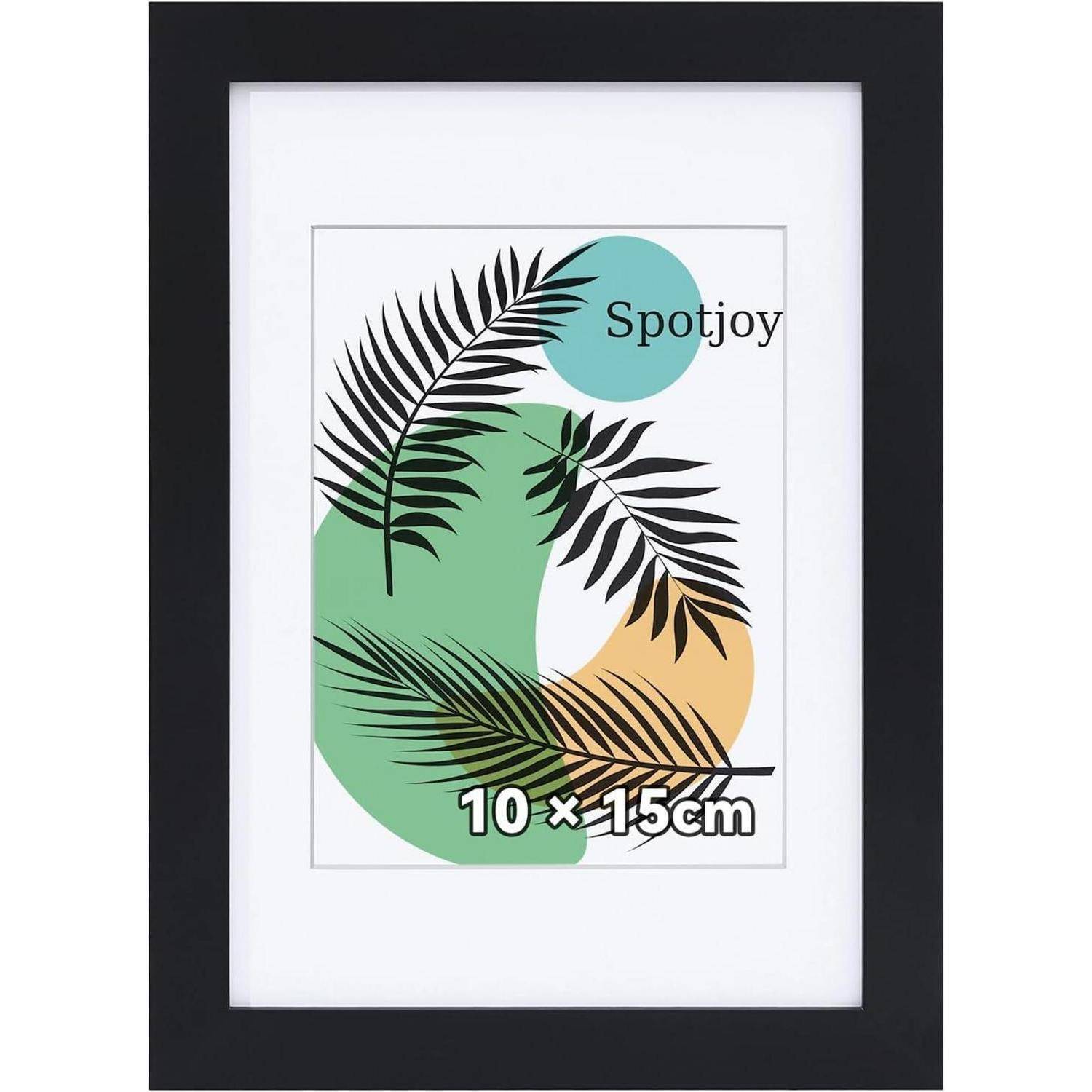 Ein gerahmtes Bild mit abstrakten Blattdesigns, die über farbenfrohen Kreisen überlagert sind, mit dem Text 'Spotjoy' und den Maßen '10 x 15 cm'.