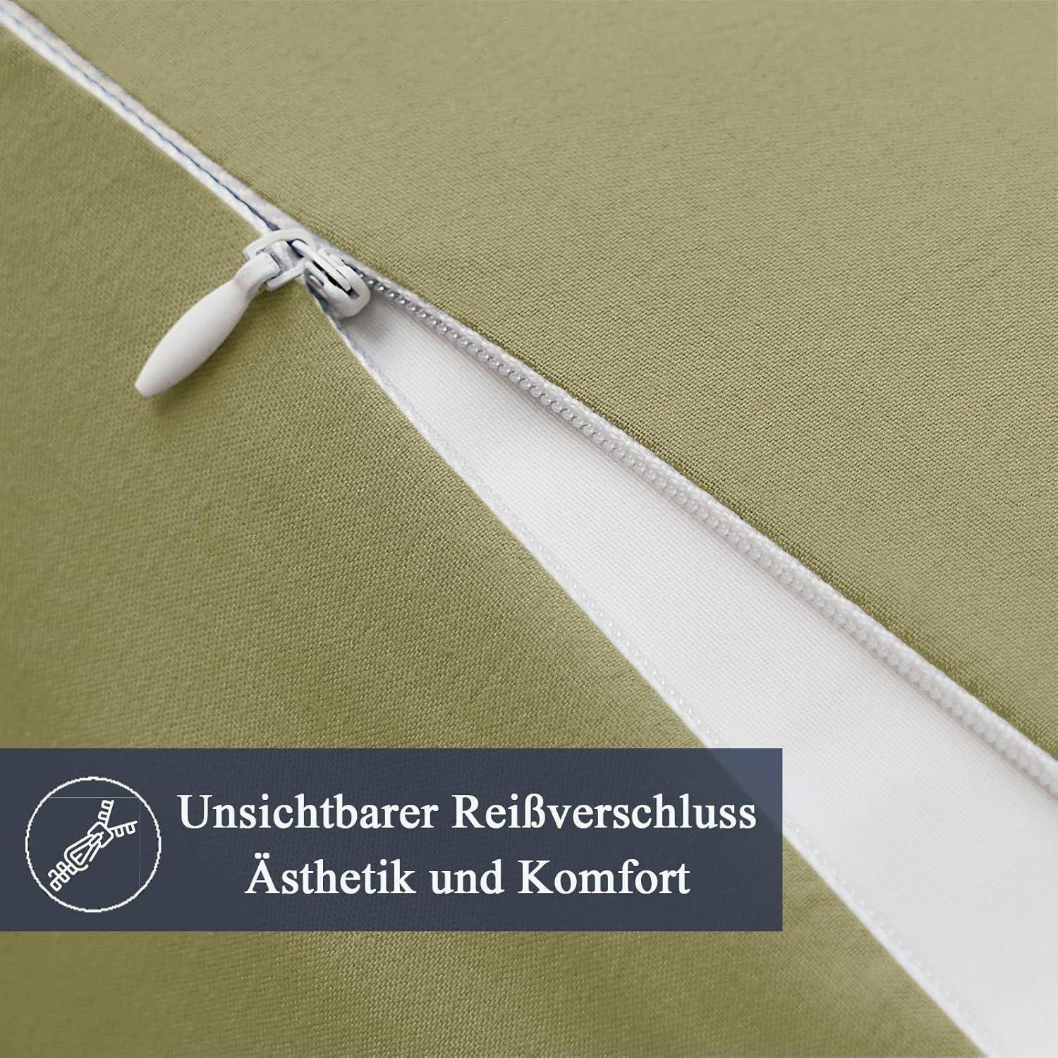 Eine Nahaufnahme eines grünen Kissenbezugs, die einen teilweise geöffneten unsichtbaren Reißverschluss zeigt und dessen dezentes und komfortables Design demonstriert.