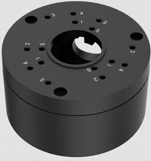 Ein schwarzes, zylindrisches mechanisches Teil mit mehreren kleinen Löchern auf der Oberseite, nummeriert von 1 bis 4. Es scheint ein Zahnrad oder ein Kupplungselement zu sein.