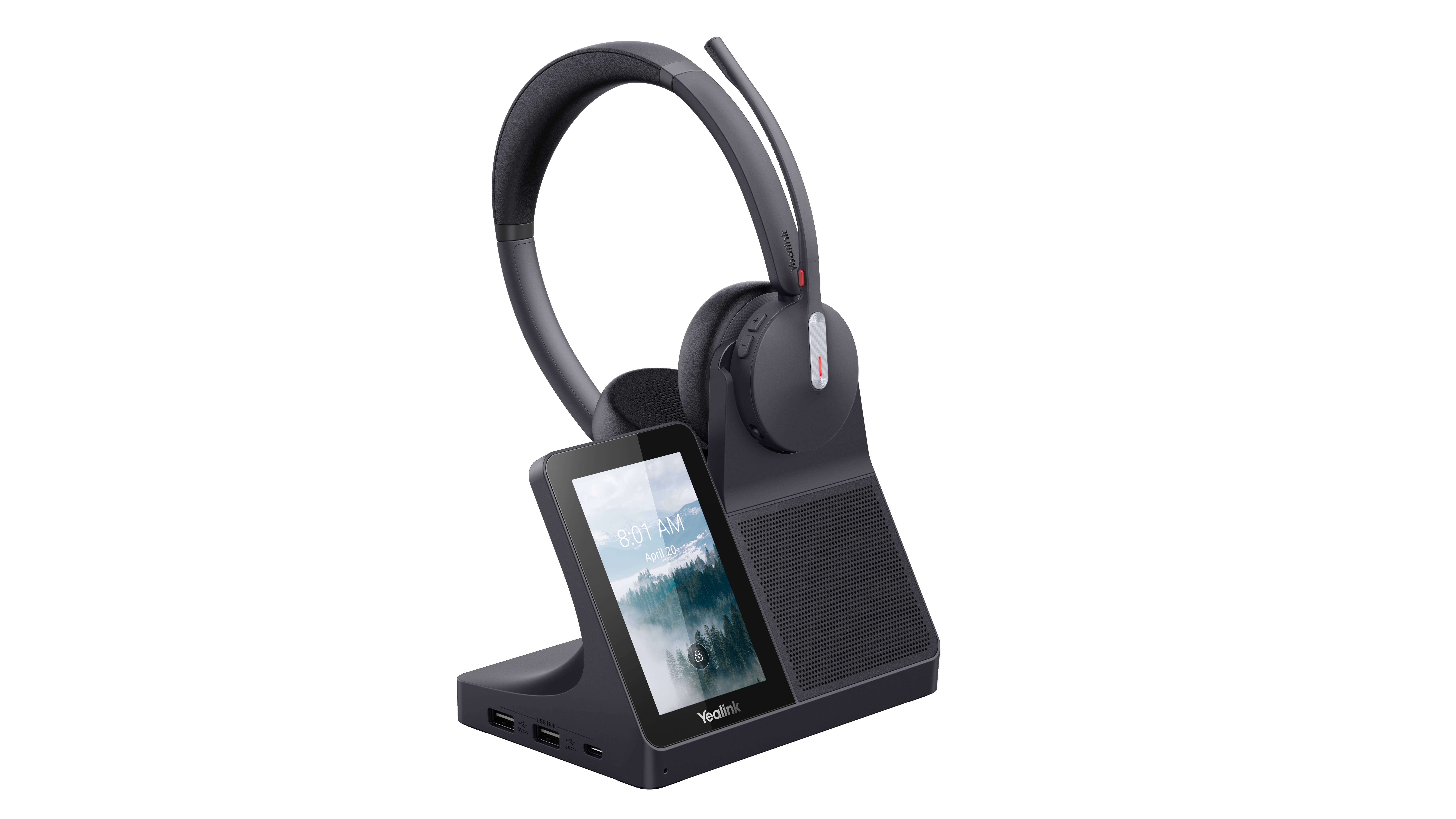 Drahtlose Ladestation mit Over-Ear-Kopfhörern, die oben aufliegen, und einem Smartphone aufrecht auf der vorderen Ladebucht, vor schwarzem Hintergrund dargestellt.
