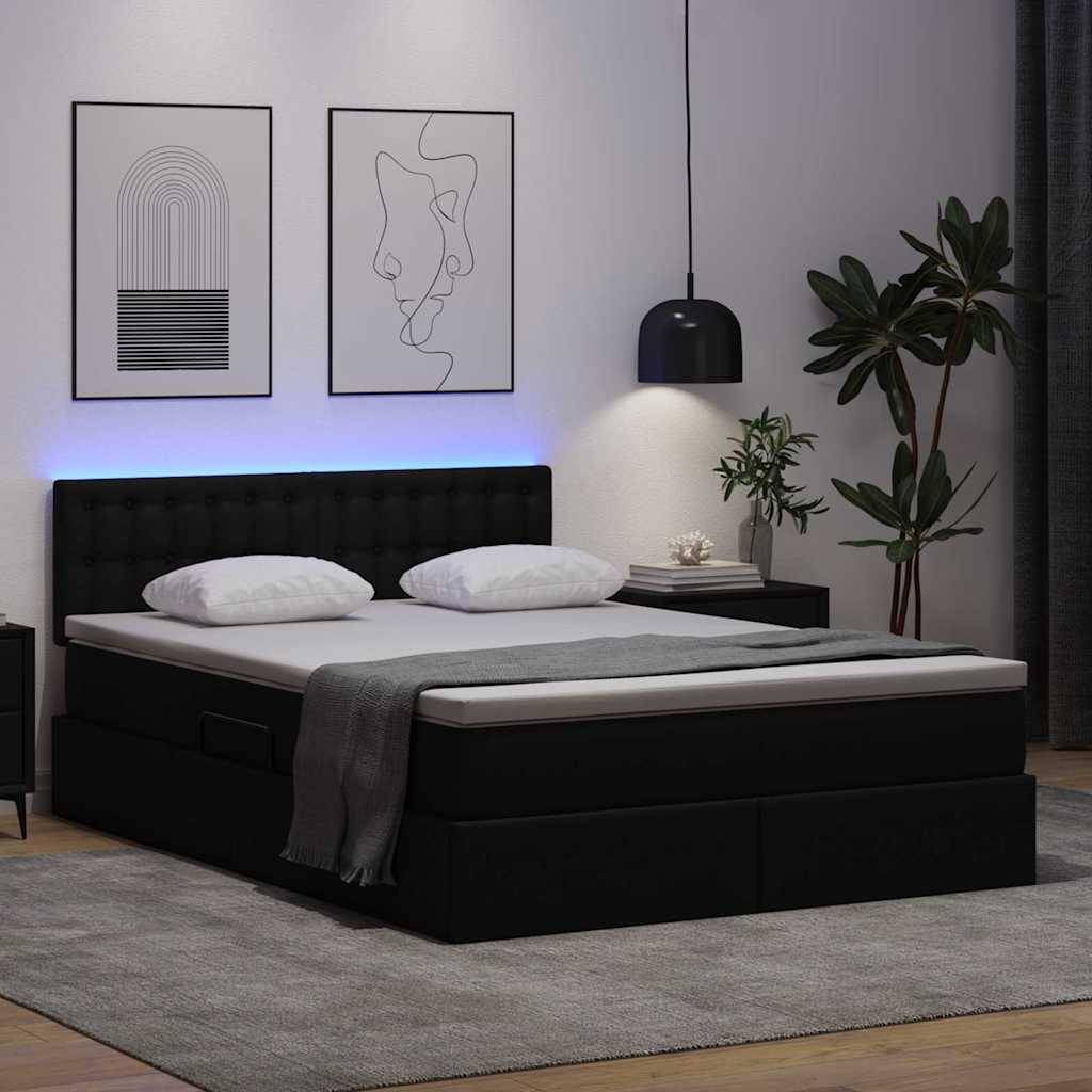 Modernes Schlafzimmer mit schwarzem Bett, weißer Bettwäsche und blau beleuchtetem Kopfteil. Zwei abstrakte Wandkunstrahmen, eine Pflanze und eine Lampe.