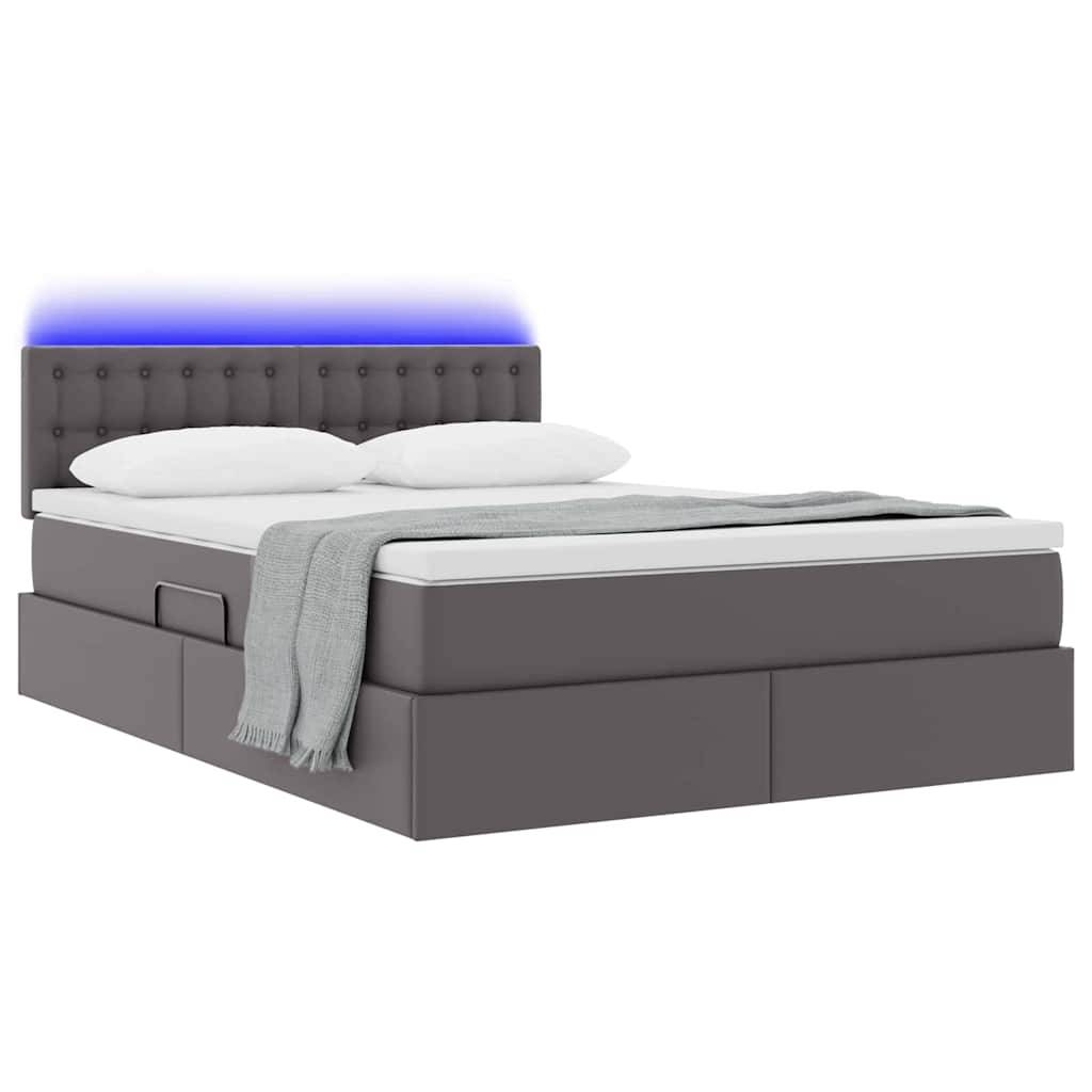 Ein modernes Bett mit gestepptem Kopfteil und integrierter blauer LED-Beleuchtung. Das Bett hat eine weiße Matratze, zwei Kissen und eine graue Decke.