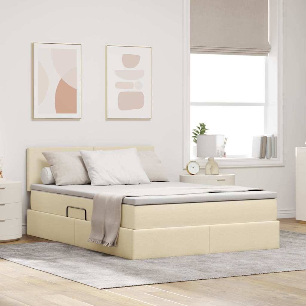 Ein beige gepolstertes Bett mit Schubladen zur Aufbewahrung, knackig weiße Bettwäsche und Kissen in einem modernen Schlafzimmer. Kunstwerke und ein großes Fenster sorgen für zusätzliches Licht.