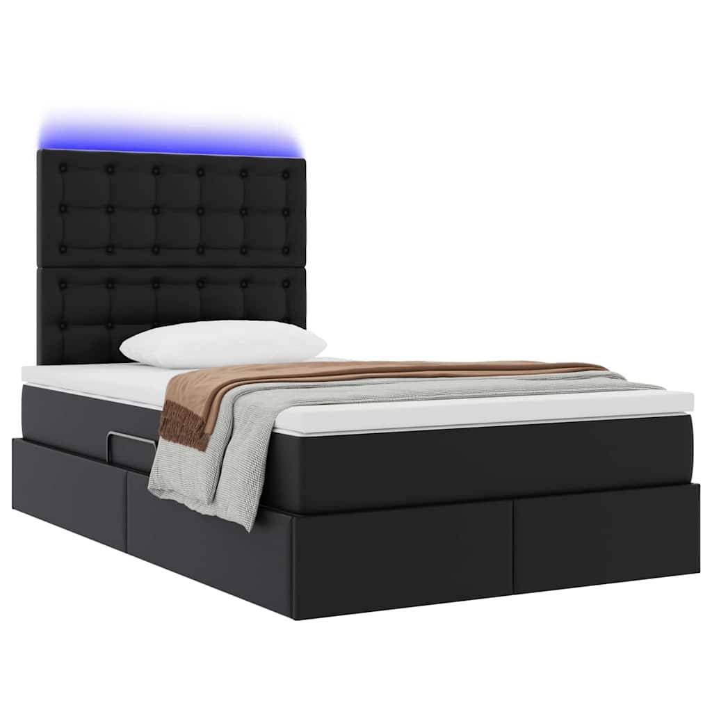 Ein schwarzes gepolstertes Bett mit gestepptem Kopfteil, LED-Leuchten und integrierten Schubladen zur Aufbewahrung, ausgestattet mit weißer Bettwäsche und einer braunen Decke.