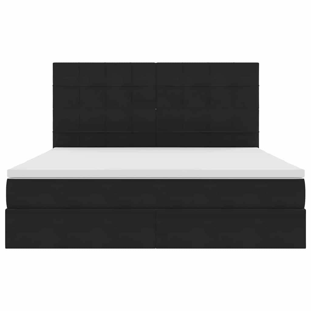 Ein Bett mit schwarzem Polsterbezug, hohem rechteckigem Kopfteil und weißer Matratze. Das Bett hat ein modernes, minimalistisches Design.