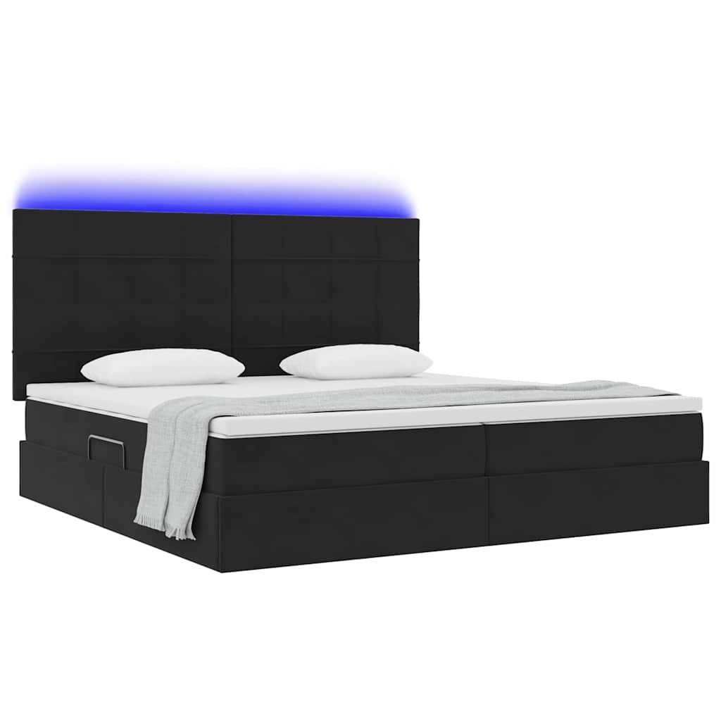 Schwarzes Plattformbett mit gepolstertem Kopfteil, leuchtende blaue Lichtakzent an der Oberseite. Das Bett ist ordentlich gemacht mit weißen Laken und Kissen.