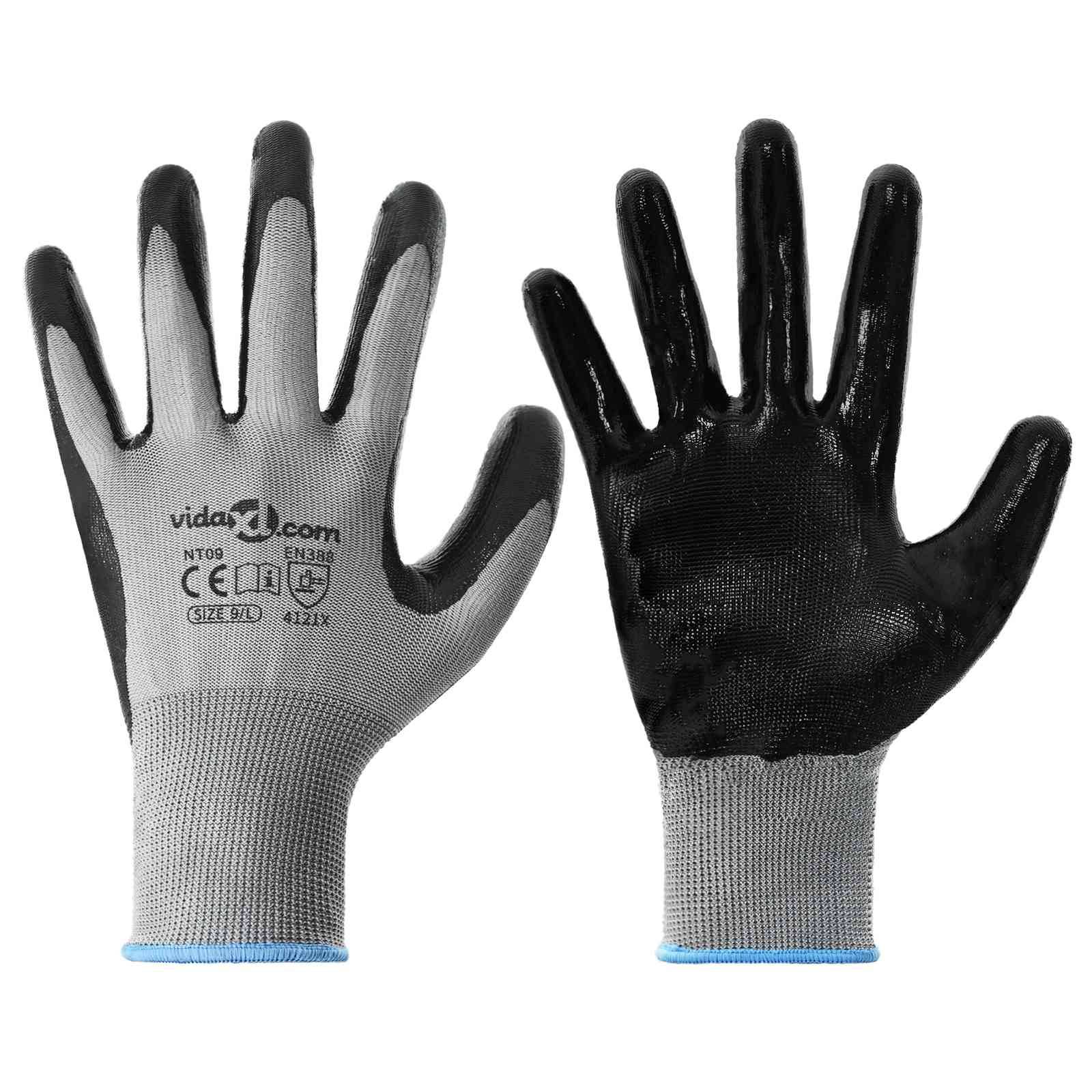 Zwei Arbeitshandschuhe, einer mit der Handfläche nach oben und einer schwarzen Griffoberfläche und der andere mit der Handfläche nach unten und grauem Stoff.