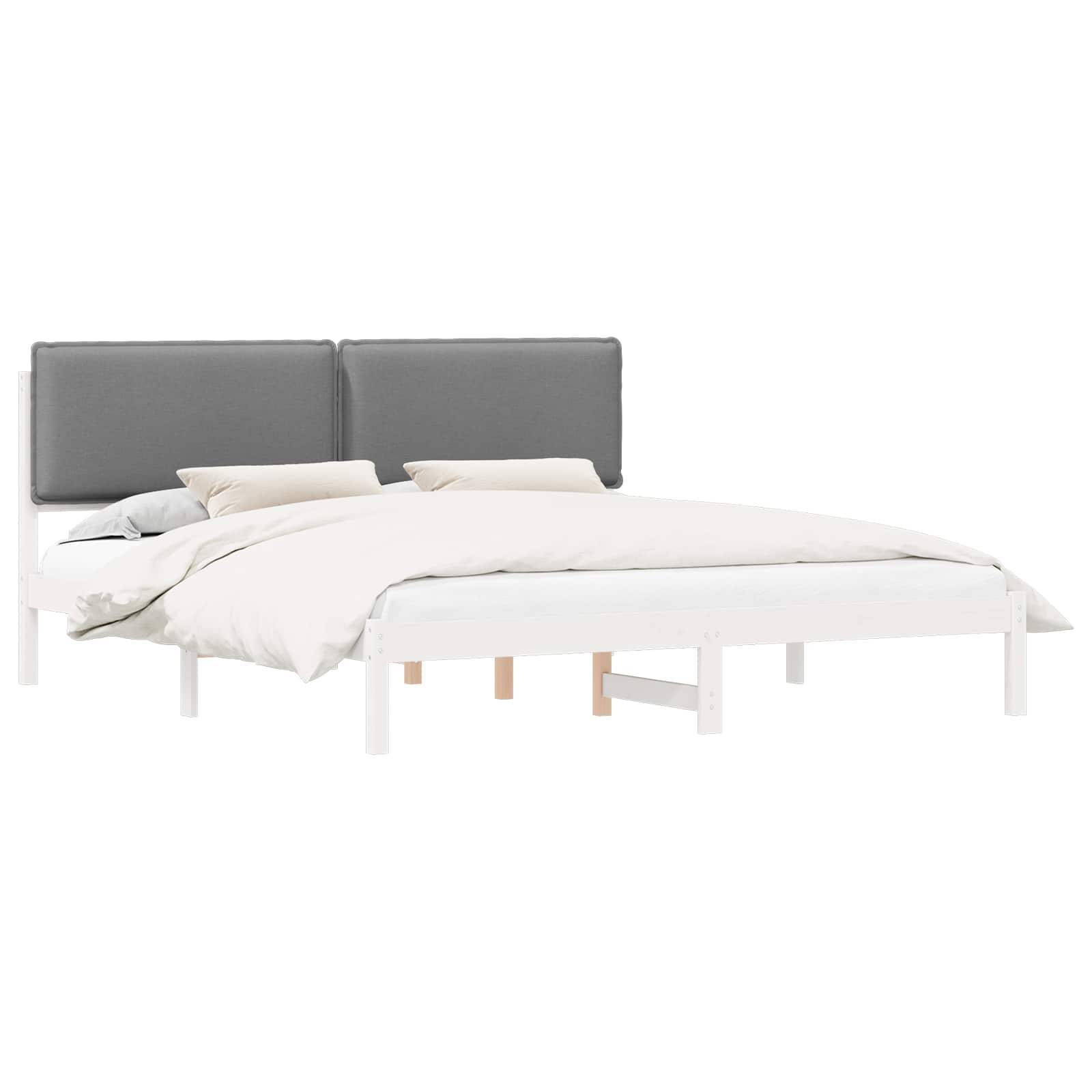 Ein moderner weißer Bettrahmen mit grauem Kopfteil und heller Bettwäsche, mit einem einfachen, minimalistischen Design in einer Schlafzimmerumgebung.