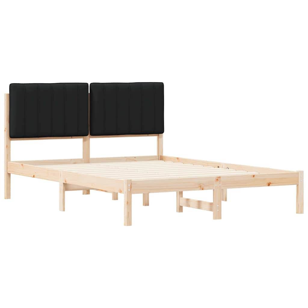 Ein leichter Holzbettrahmen mit einer Lattenrost-Basis und zwei gepolsterten schwarzen Kopfteilen. Es ist weder eine Matratze noch Bettwäsche vorhanden.
