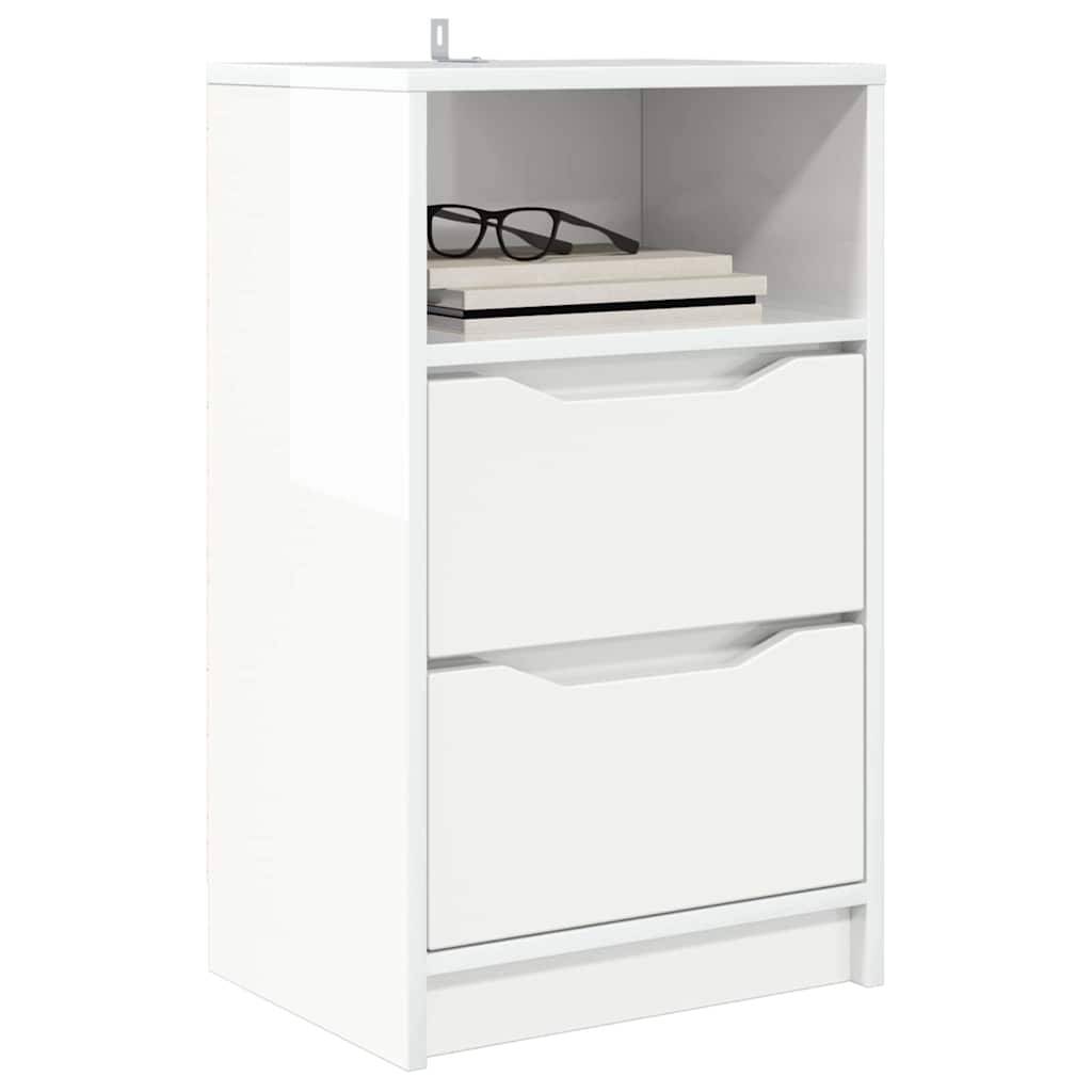 Weißer Schrank mit zwei Schubladen und einem offenen Regal, auf dem ein Brillenpaar und zwei Bücher stehen.