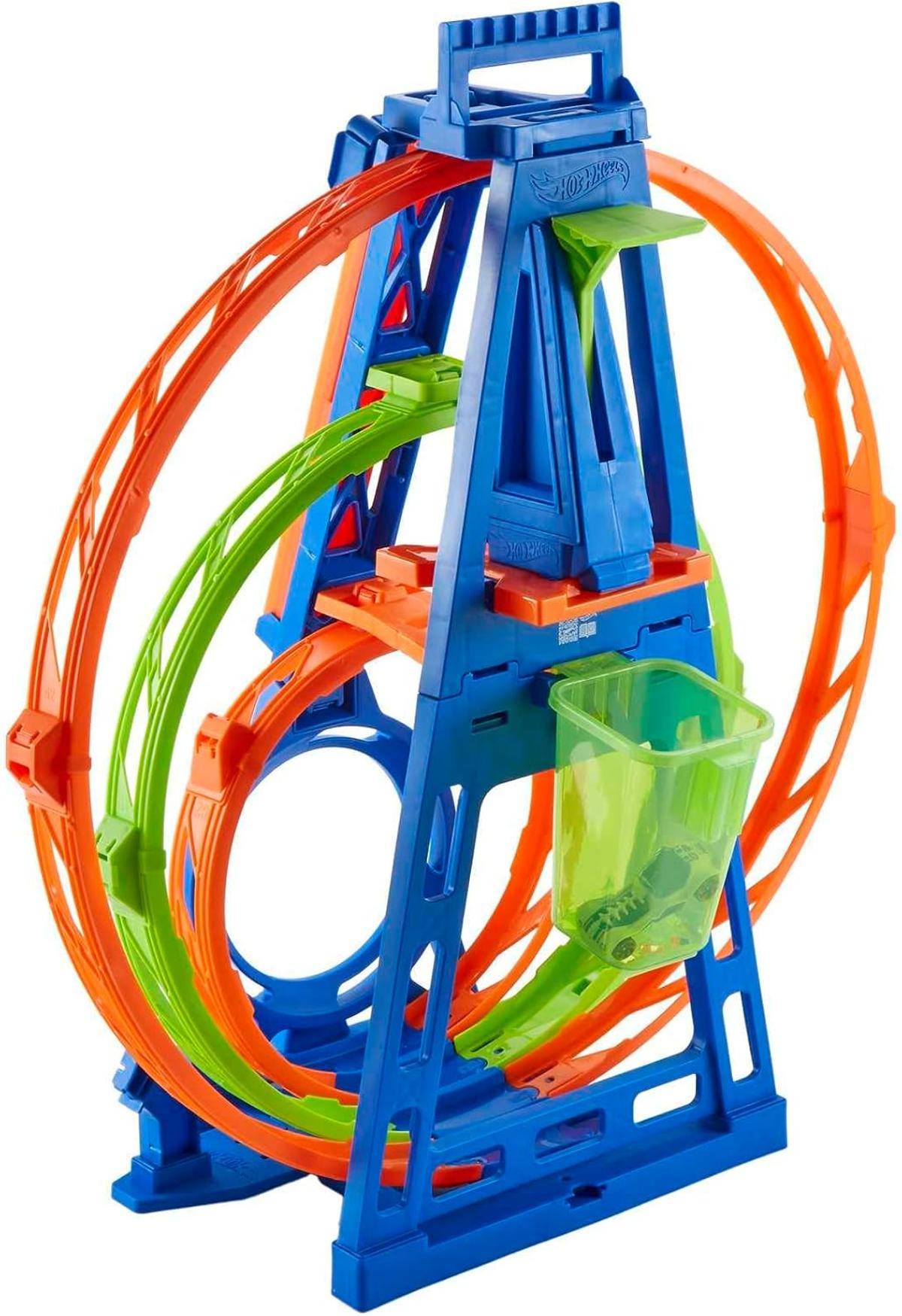 Ein buntes Plastikspielzeug verfügt über eine sich windende, spiralförmige Bahn zum Rollen von Murmeln, mit roten, blauen, grünen und orangefarbenen Abschnitten.