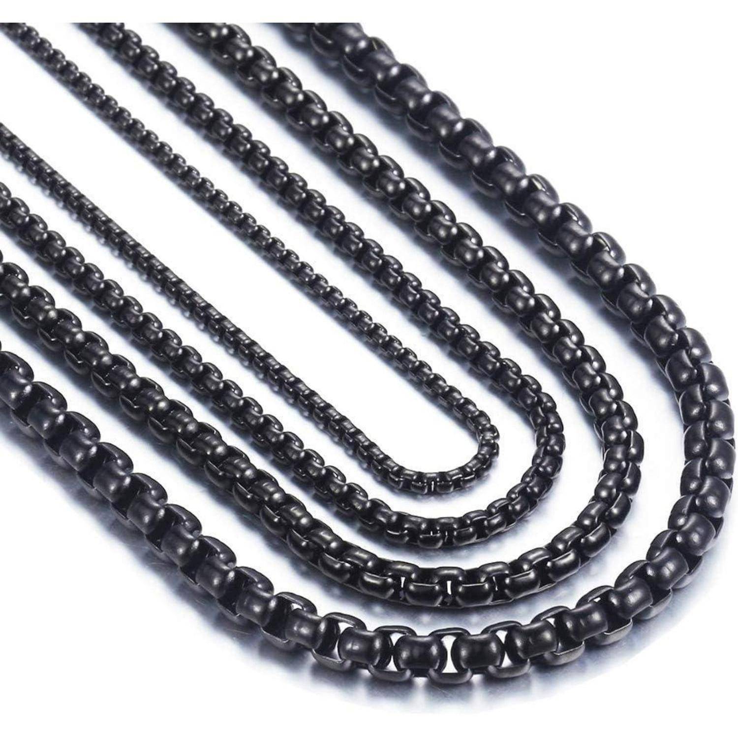 Mehrere schwarze Metallketten unterschiedlicher Längen und Stärken, angeordnet von der kürzesten und dünnsten bis zur längsten und dicksten.
