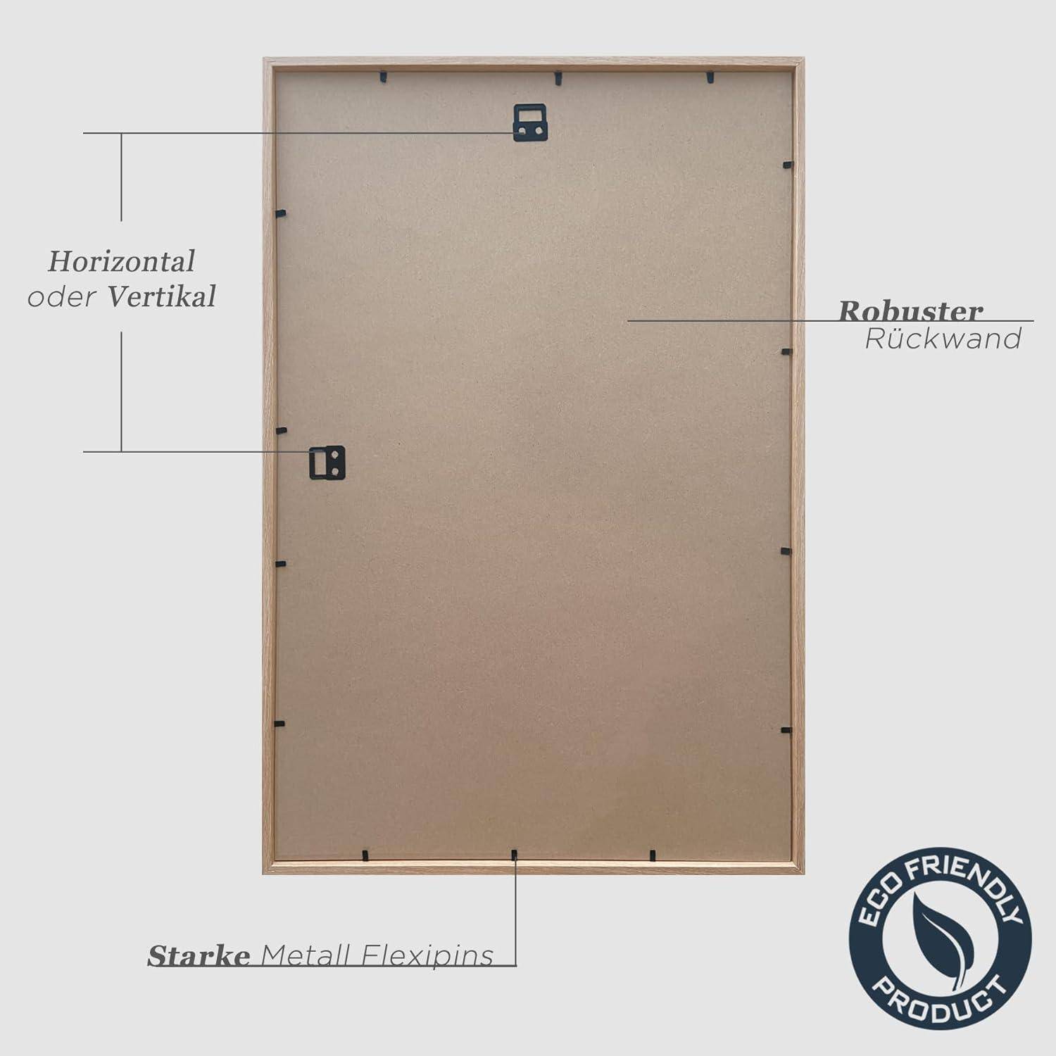 Rückansicht eines Holzbilderrahmens mit Metallflexipins für horizontale oder vertikale Präsentation. Etikett zeigt 'Umweltfreundliches Produkt'.