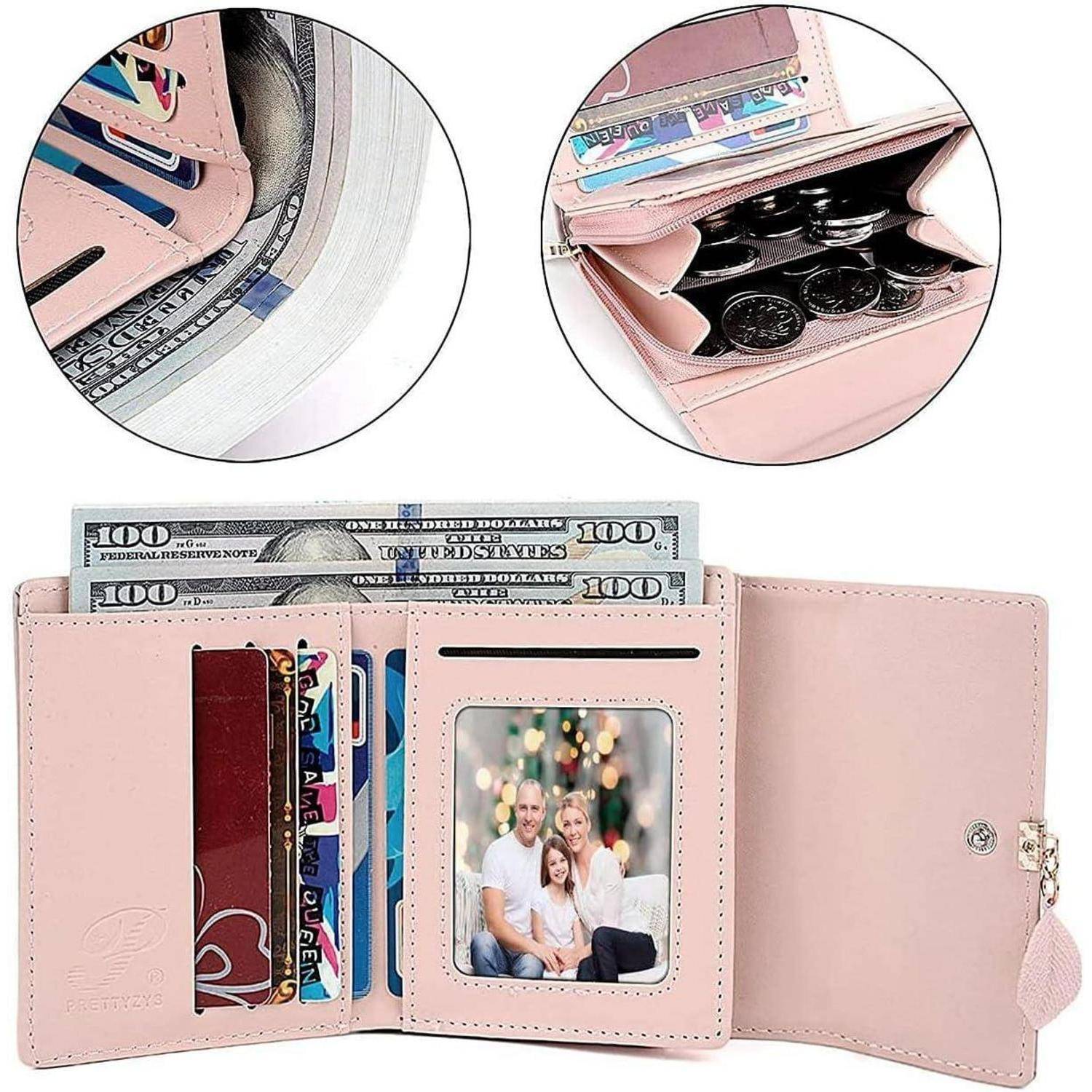 Eine rosa Geldbörse, geöffnet, zeigt Kartenfächer, Bargeld, ein Familienphoto und eine zugeknöpfte Münzfach-Tasche.