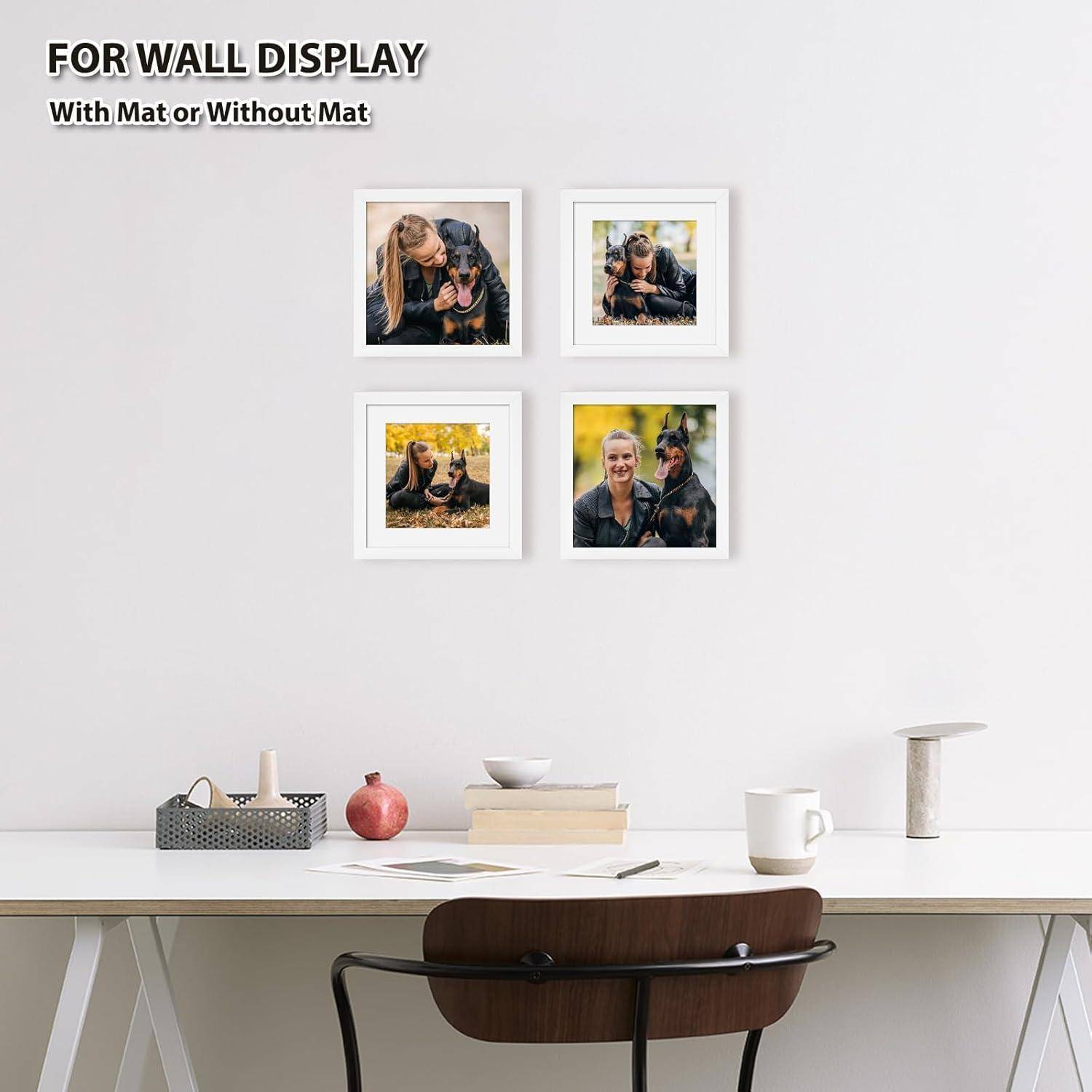 Ein moderner weißer Schreibtisch und ein Stuhl mit dekorativen Gegenständen unter vier gerahmten Hundefotos an der Wand, die Wanddisplay-Optionen präsentieren.