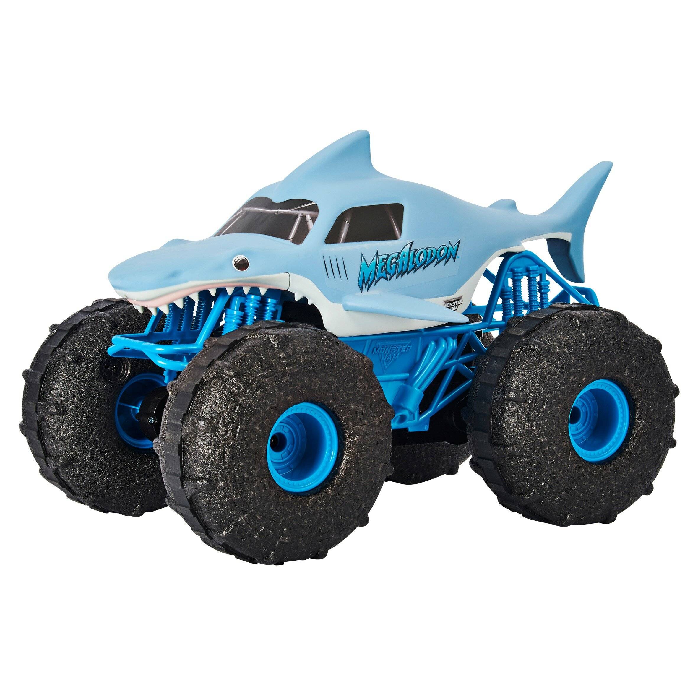 Ein Spielzeug-Monstertruck mit einem blauen Haidesign, großen Reifen und dem Wort 'Megalodon' an der Seite.