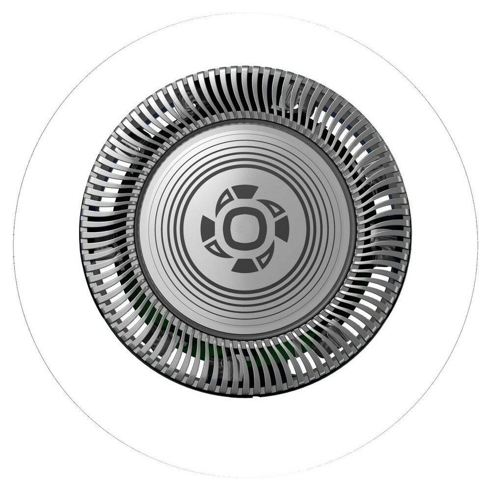 Ein kreisförmiger Metallrasieraufsatz, wahrscheinlich Teil eines Elektrorasierers, mit konzentrischen Rillen und Öffnungen zum Haarschneiden.